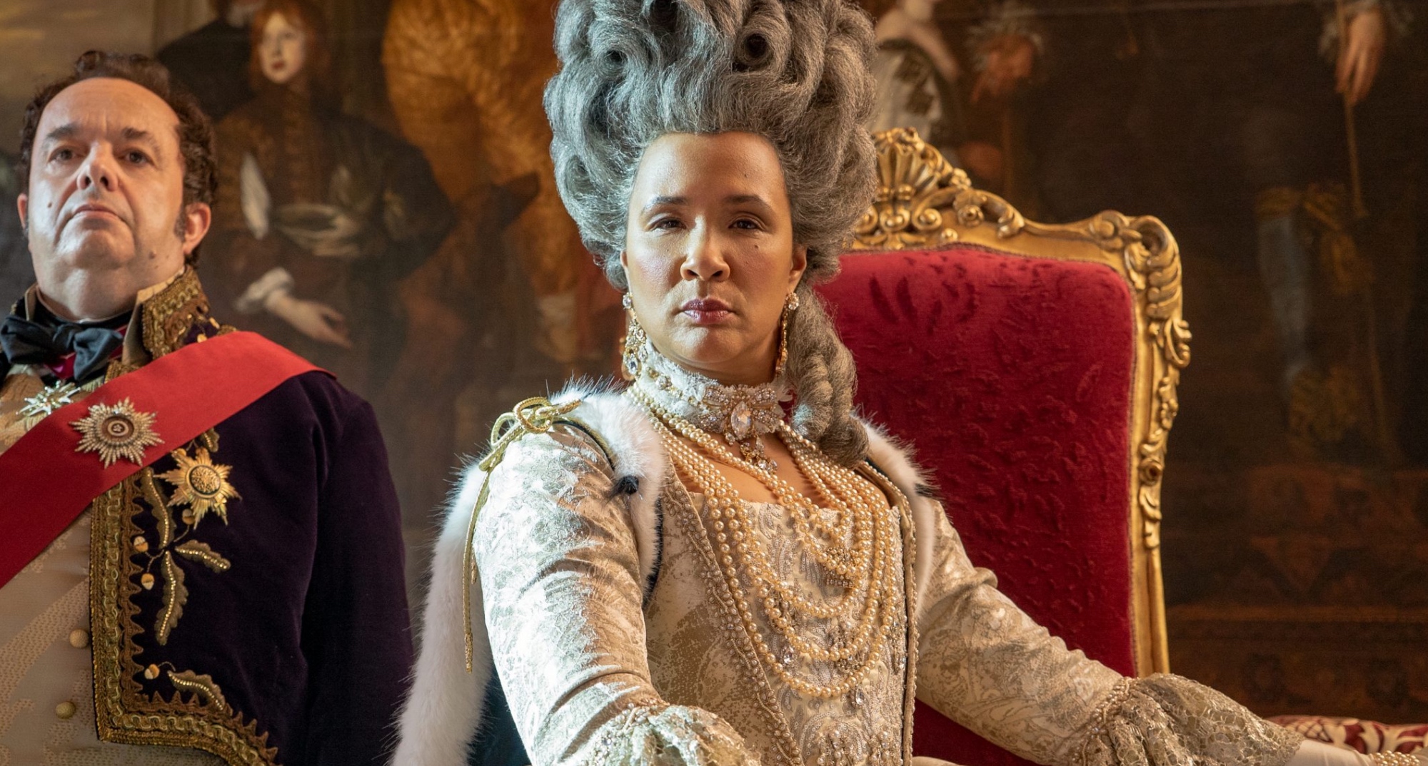 Golda Rosheuvel as Queen Charlotte in 'Bridgerton' sitting on her throne.