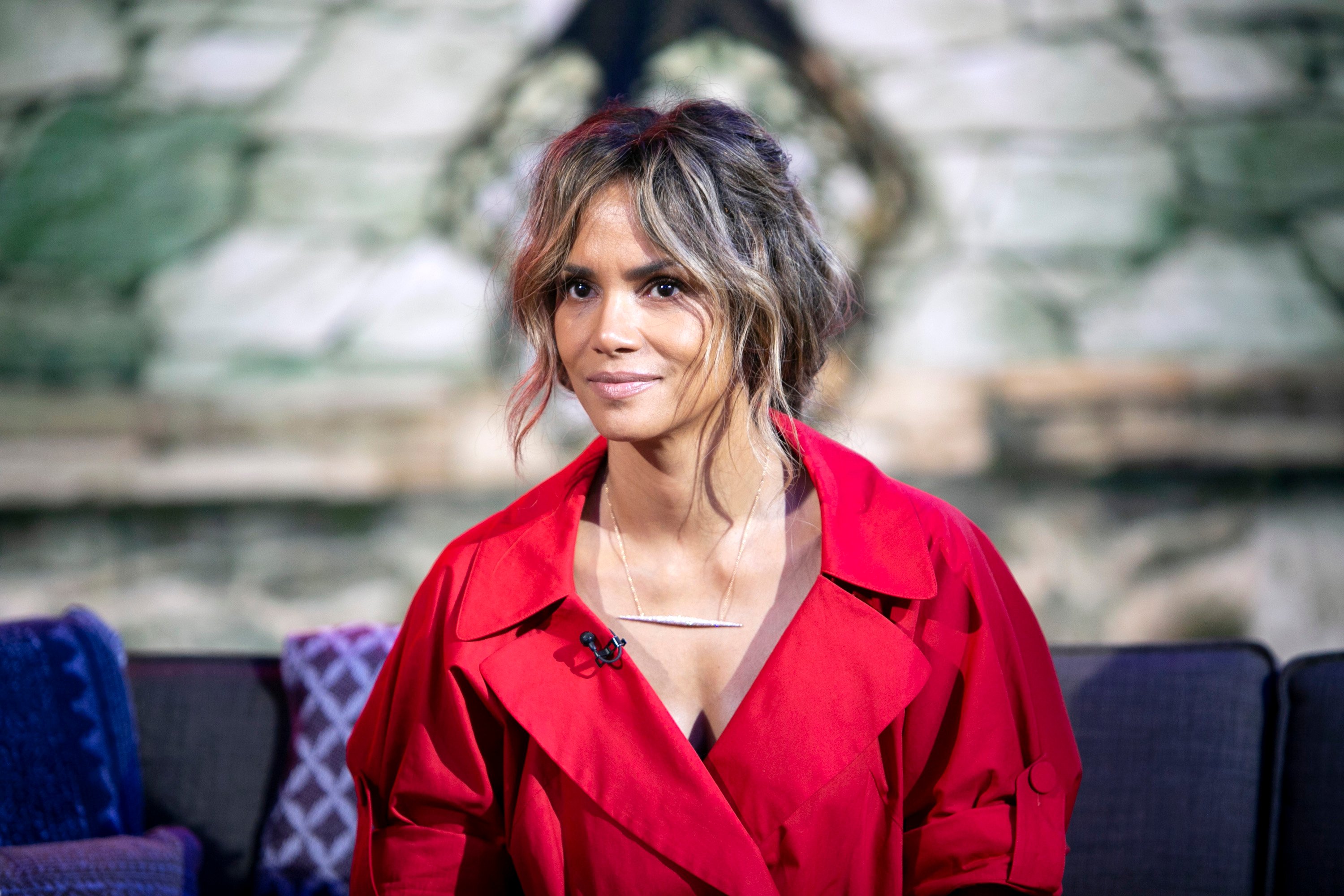 Halle Berry on TODAY wearing a red outfit accessorized with a necklace and most of hair swept back