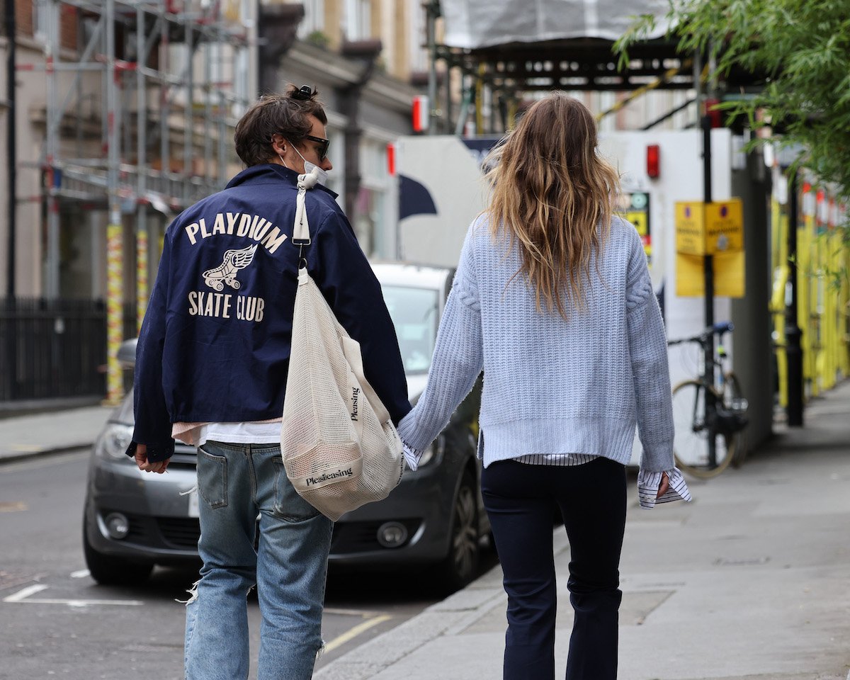 Olivia Wilde and Harry Styles hold hands while walking in Soho