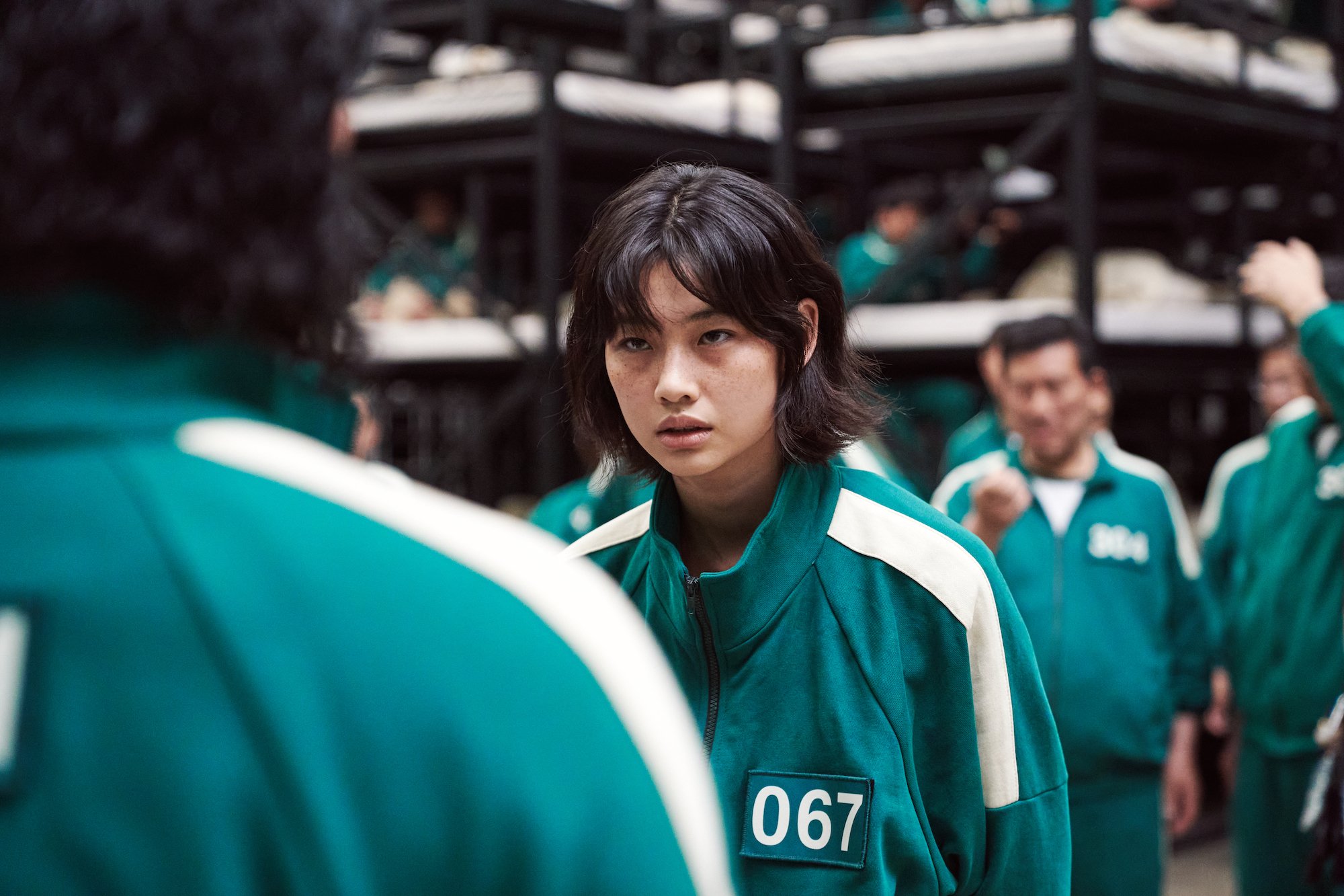 Hoyeon Jung stares at her 'Squid Game' opponent in the barracks
