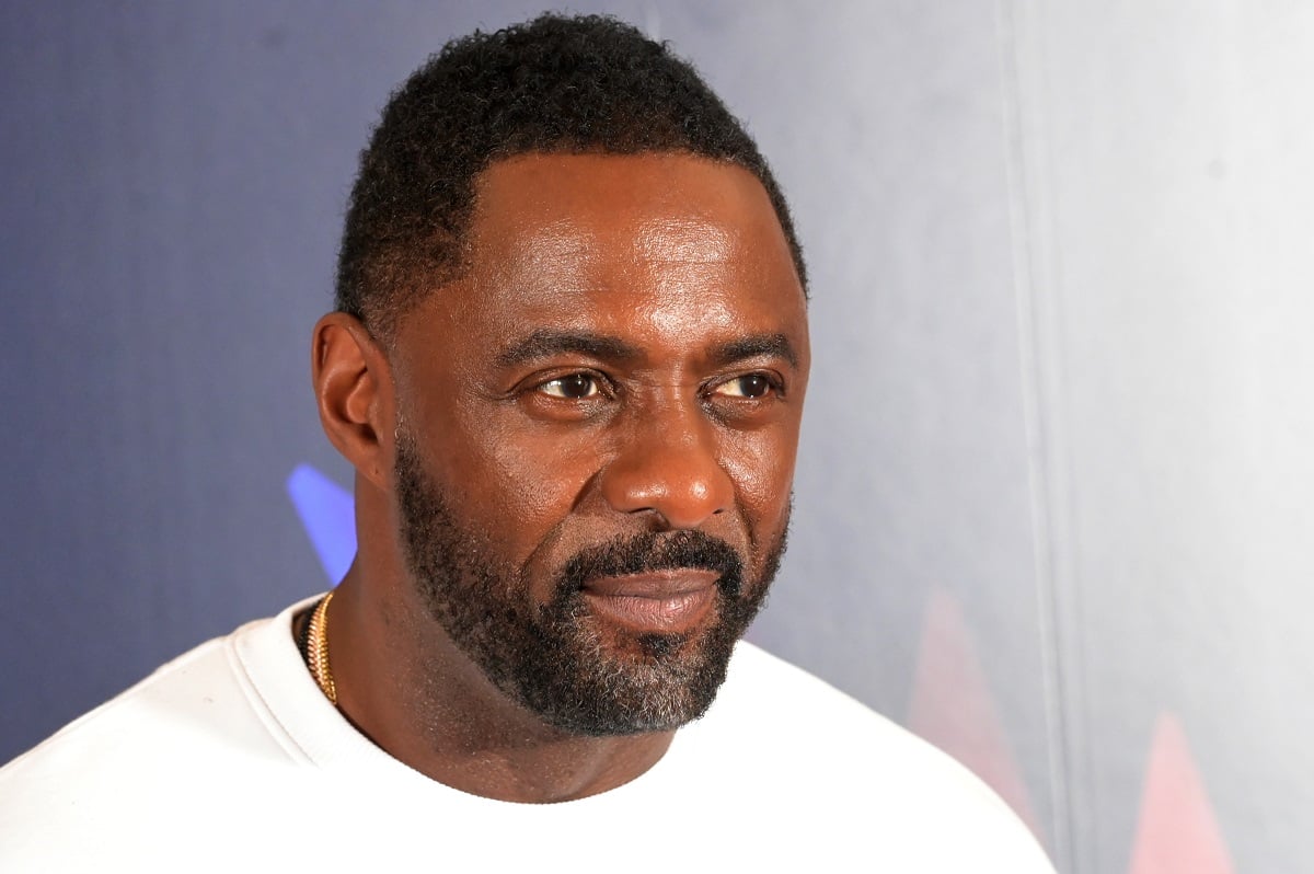 Idris Elba smirking