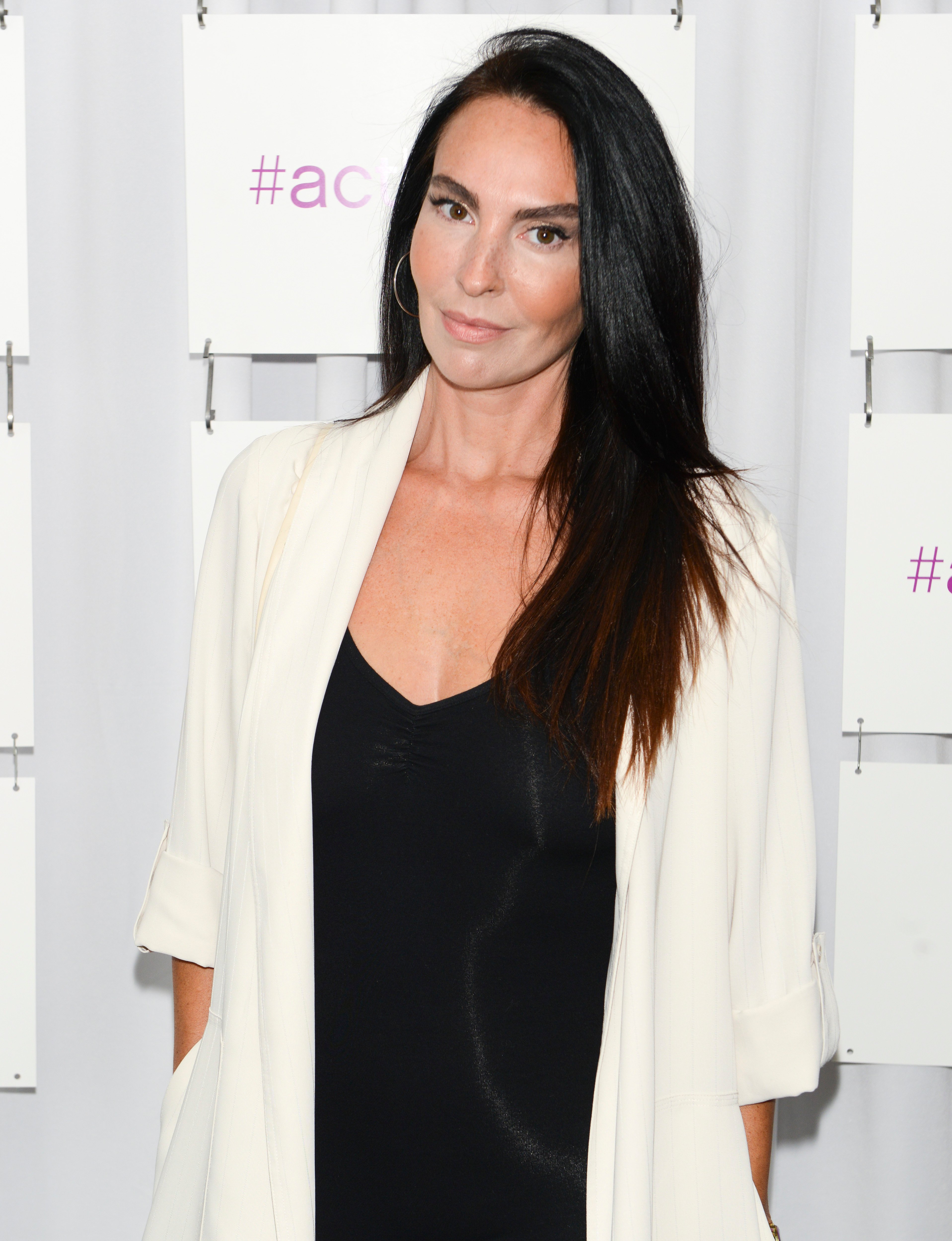 'General Hospital' actor Inga Cadranel wearing a black dress and white jacket.