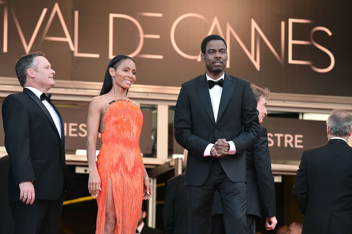 Jada Pinkett Smith and Chris Rock pose on the red carpet