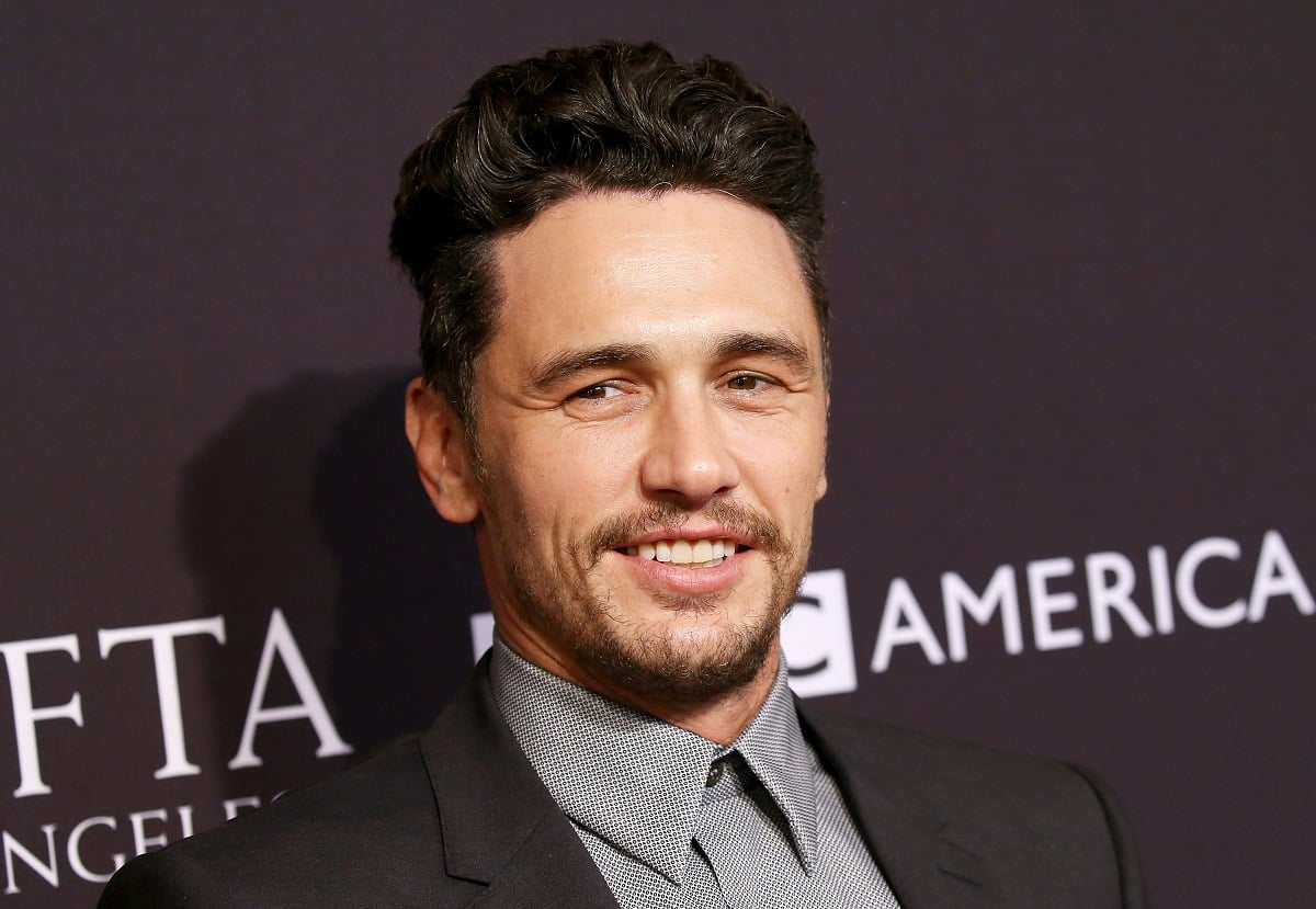 James Franco smiling while wearing a suit.