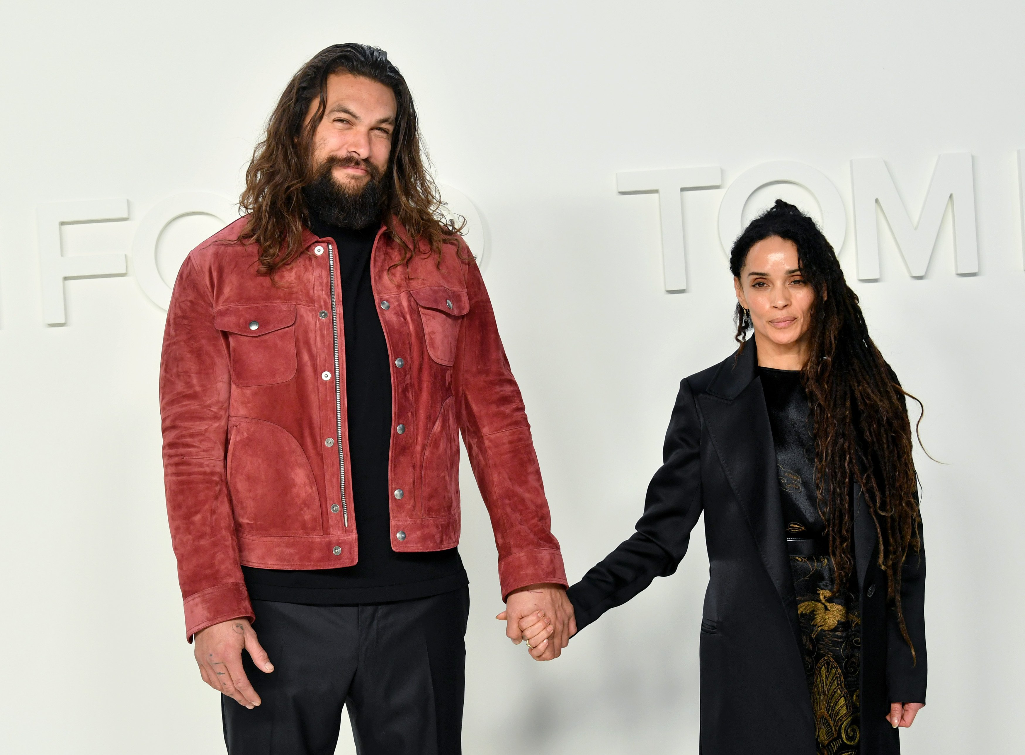 Jason Momoa and Lisa Bonet holding hands at the Tom Ford AW20 Show