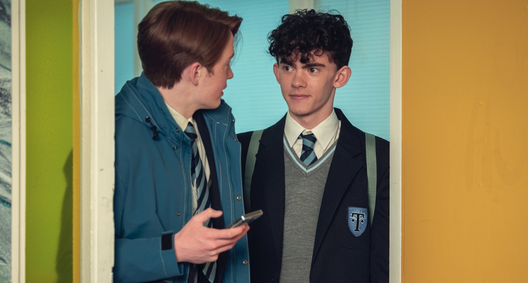 Joe Locke as Charlie Spring in 'Heartstopper' wearing a school uniform.