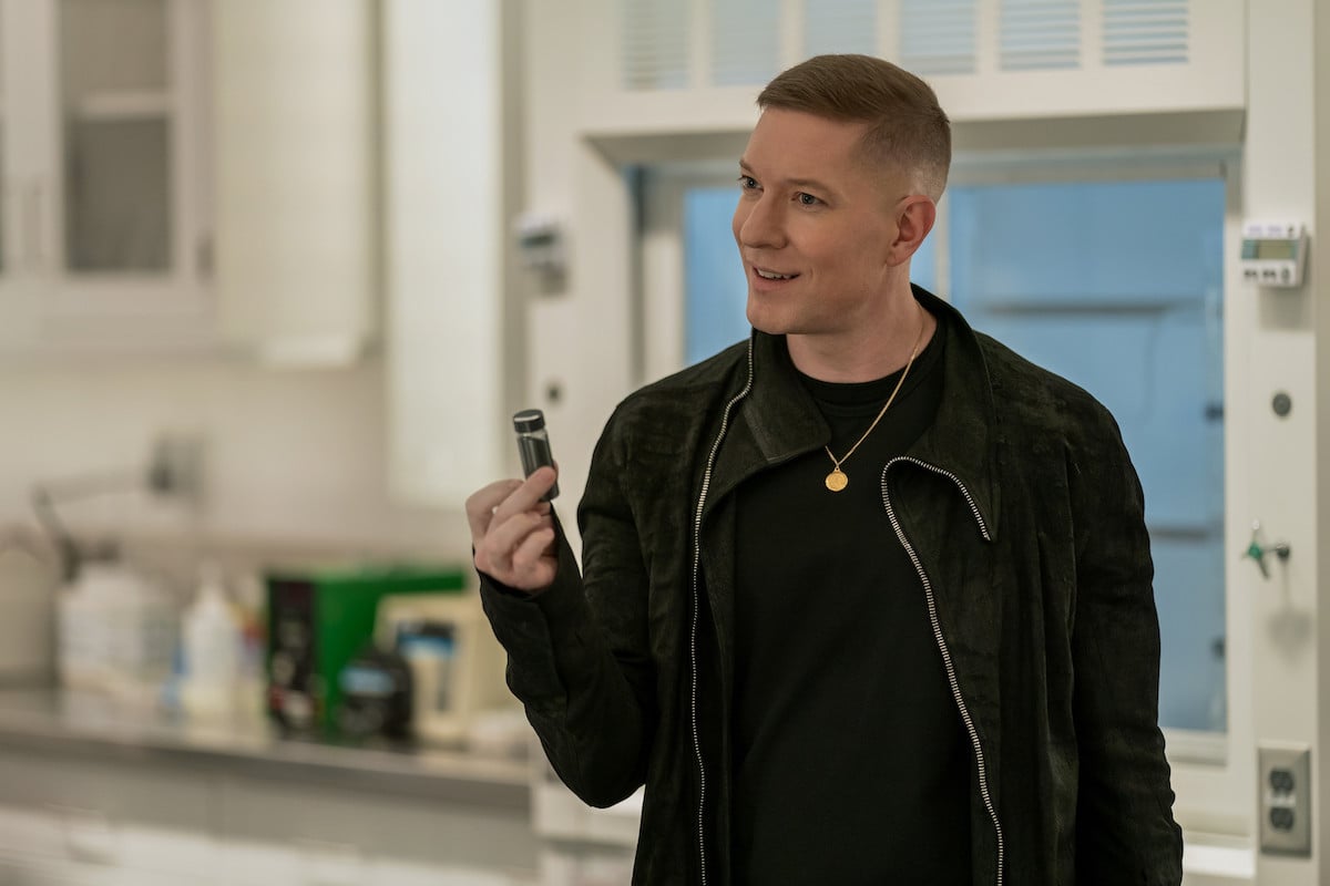 Joseph Sikora as Tommy Egan dressed in black and holding a vile of Dahlia in 'Power Book IV: Force'