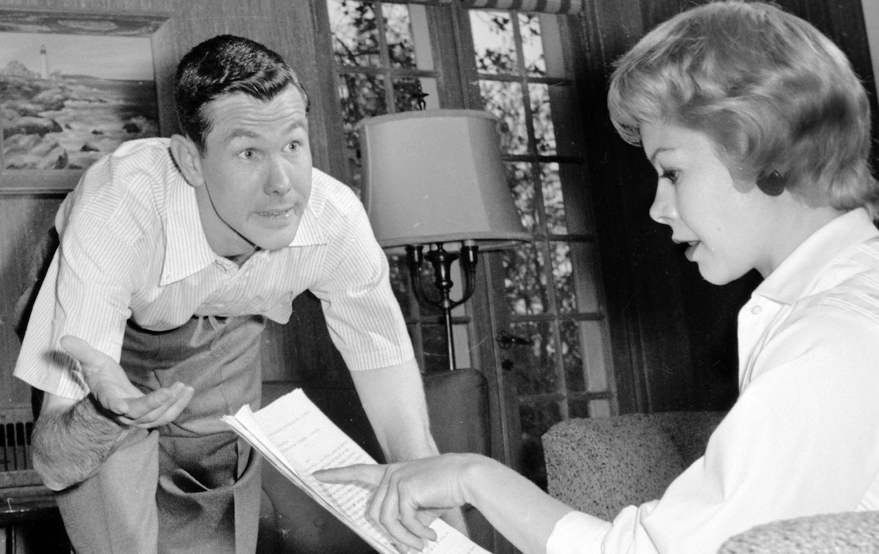 Johnny and Jody Carson rehearse a TV script in their living room c.1958