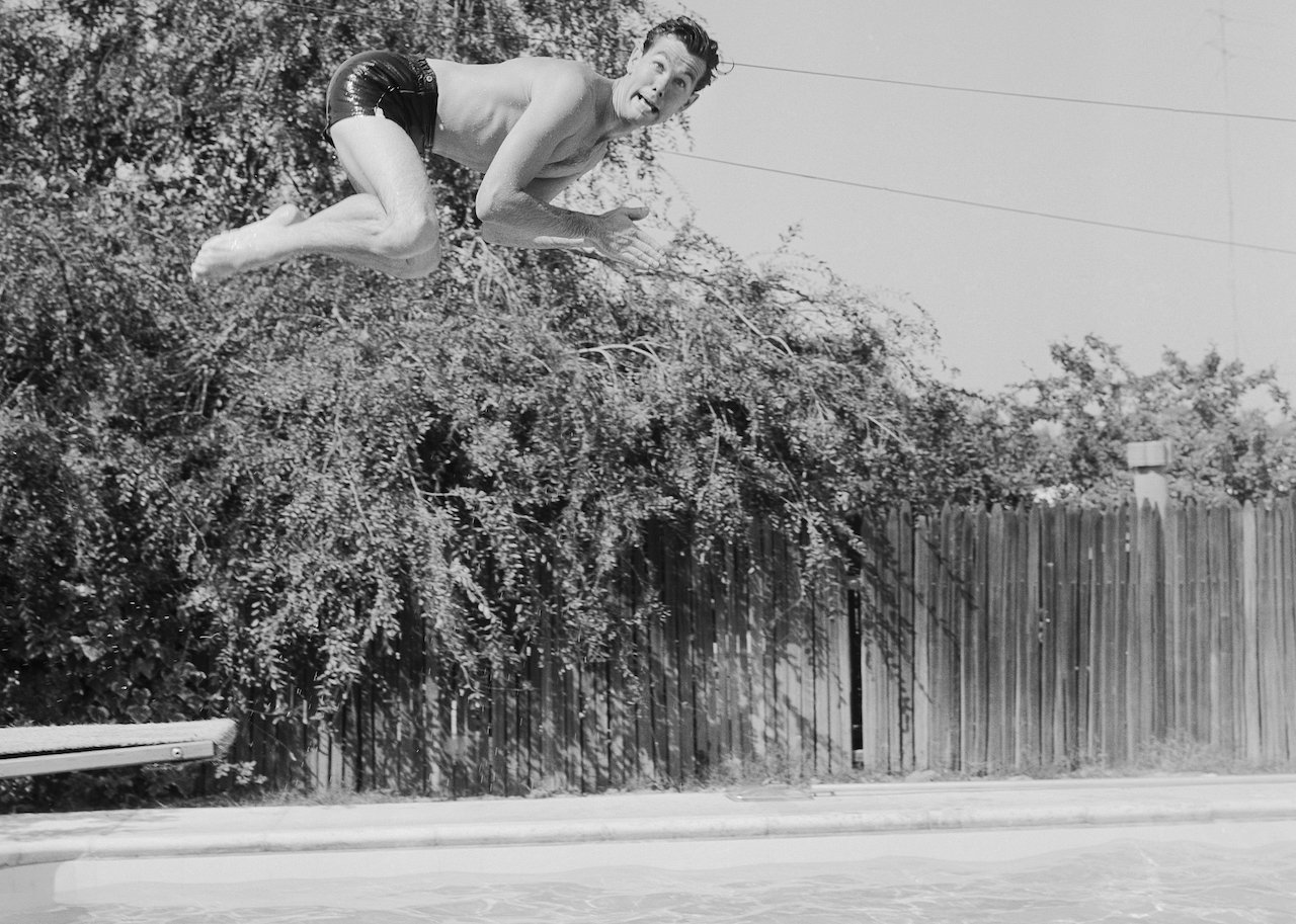 Johnny Carson dives into his backyard pool c. 1956