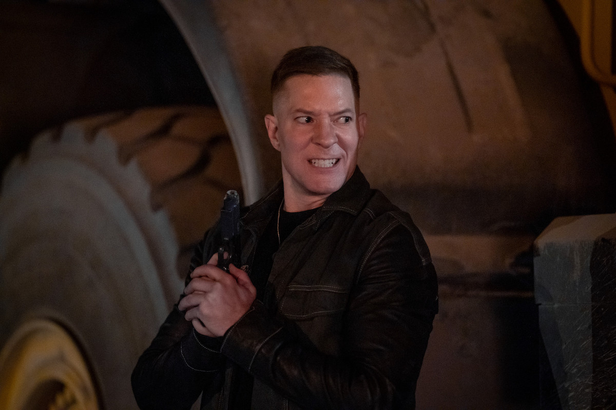 Joseph Sikora as Tommy Egan holding a gun and scowling on 'Power Book IV: Force'