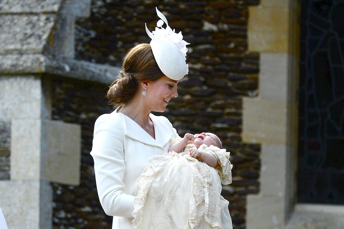 Kate Middleton does her best to wear a matching outfit with Princess Charlotte at Charlotte's 2015 christening