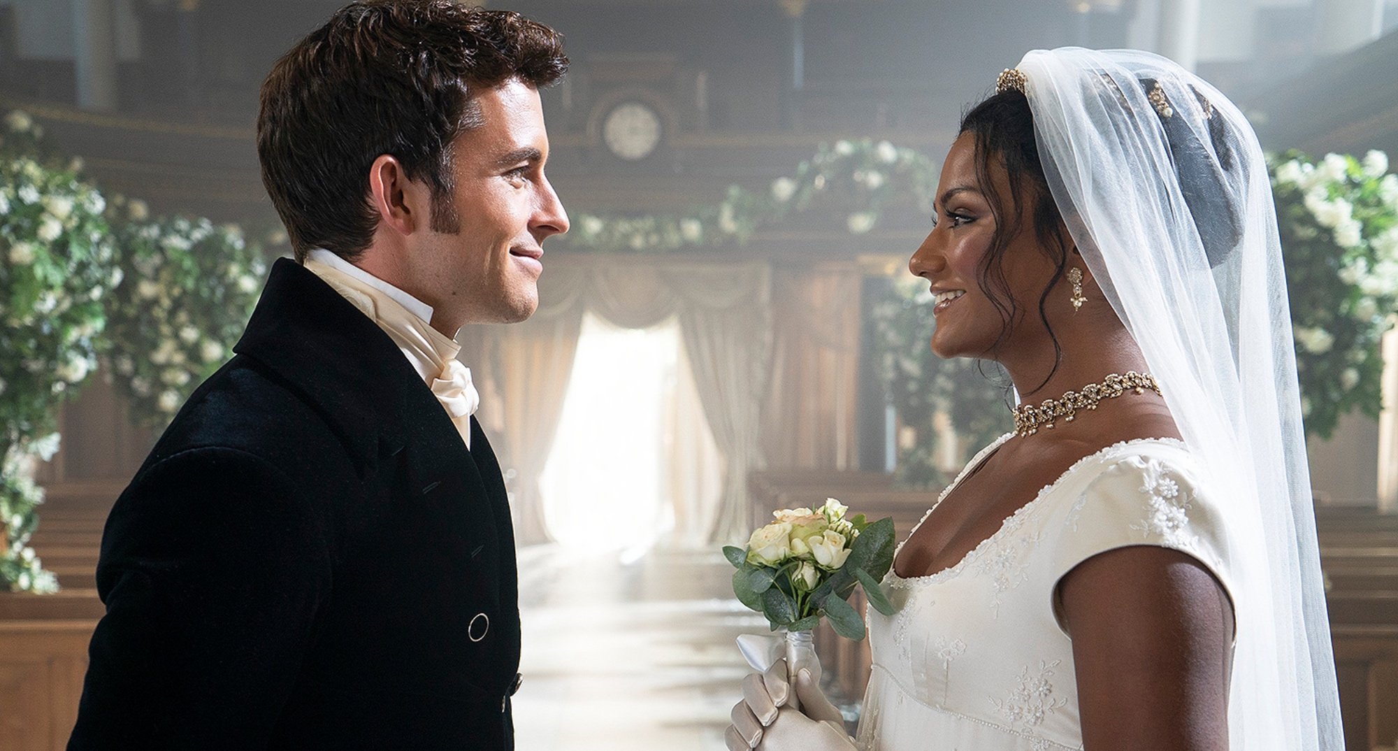 Kate and Anthony wedding scene in 'Bridgerton' Season 2 wearing dress and suit.