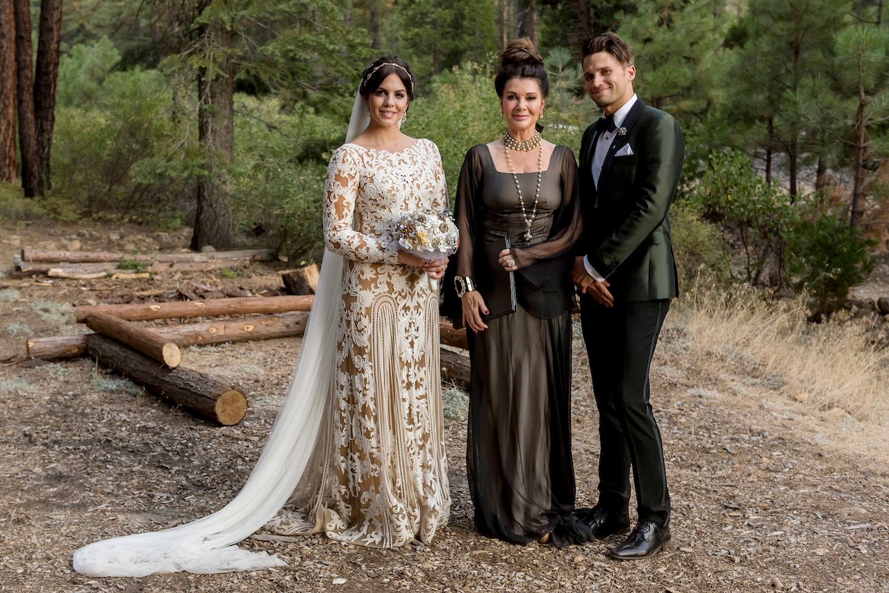 Lisa Vanderpump stands between Katie Maloney and Tom Schwartz on their wedding day