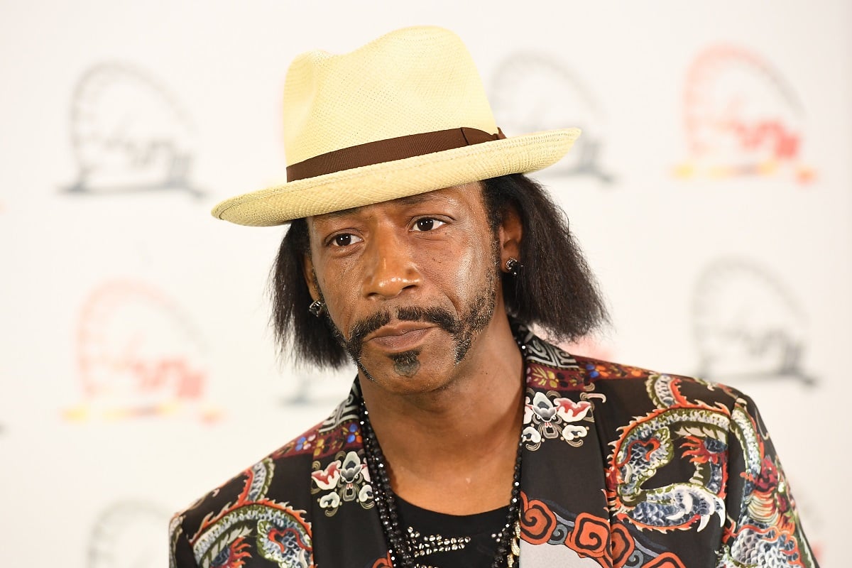 Katt Williams posing while wearing a hat.