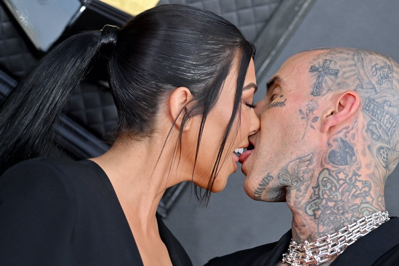 Kourtney Kardashian and Travis Barker kiss at the 2022 Grammys just hours before they got married in Las Vegas