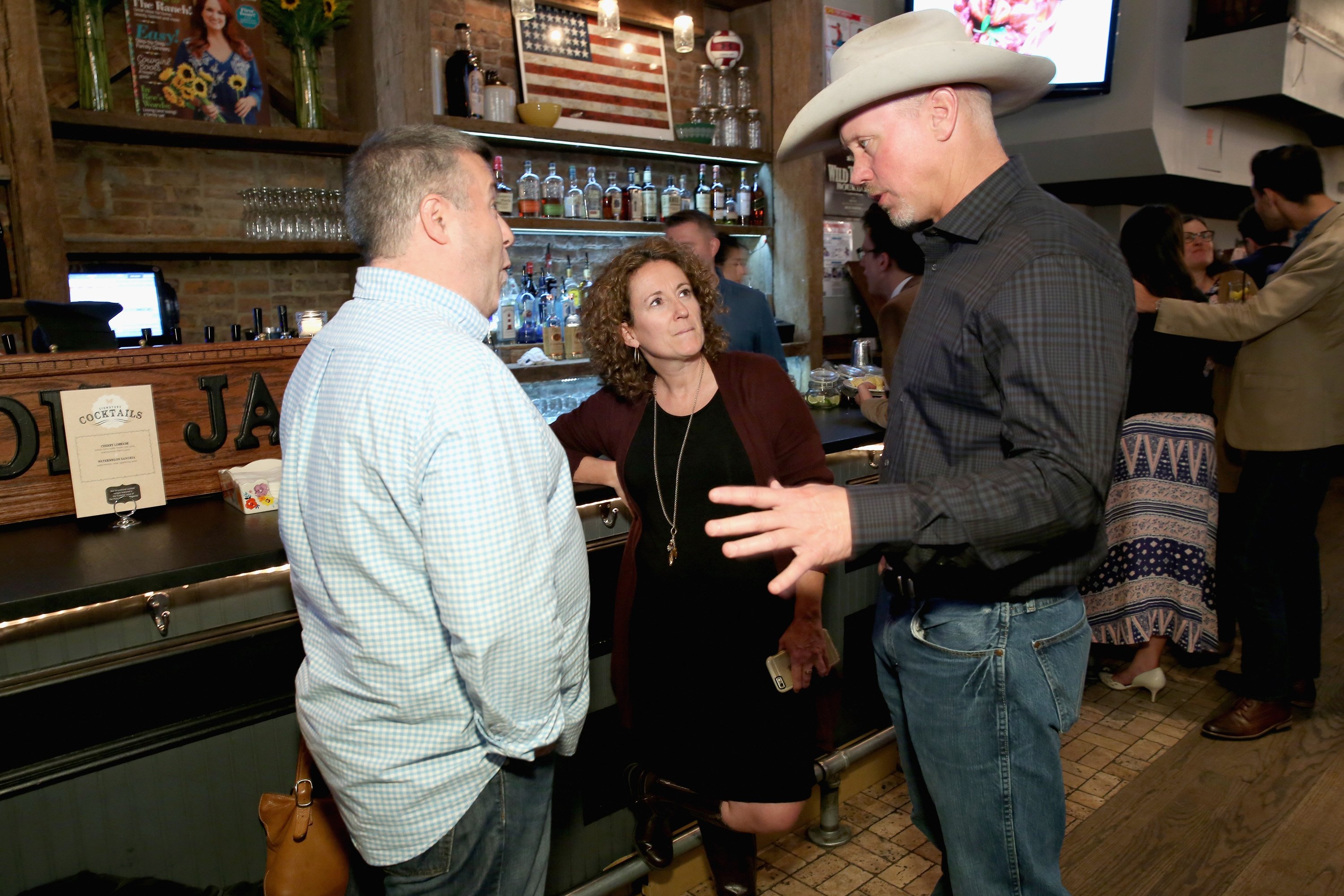 Ladd Drummond wears a cowboy hat while talking to fans at a Pioneer Woman event.