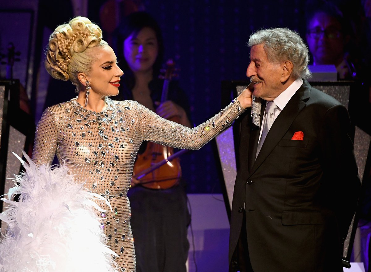 Lady Gaga touches Tony Bennett's face while performing on stage in Las Vegas, Nevada in 2019.