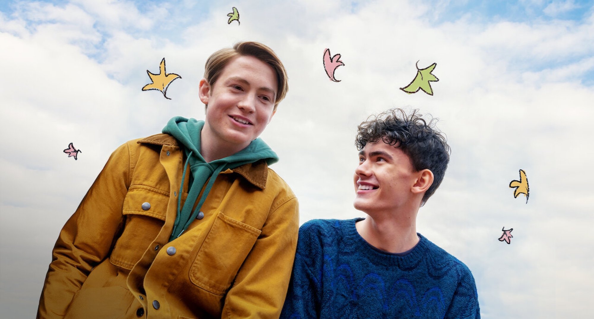 Lead actors of 'Heartstopper' series based on graphic novels sitting next to each other.