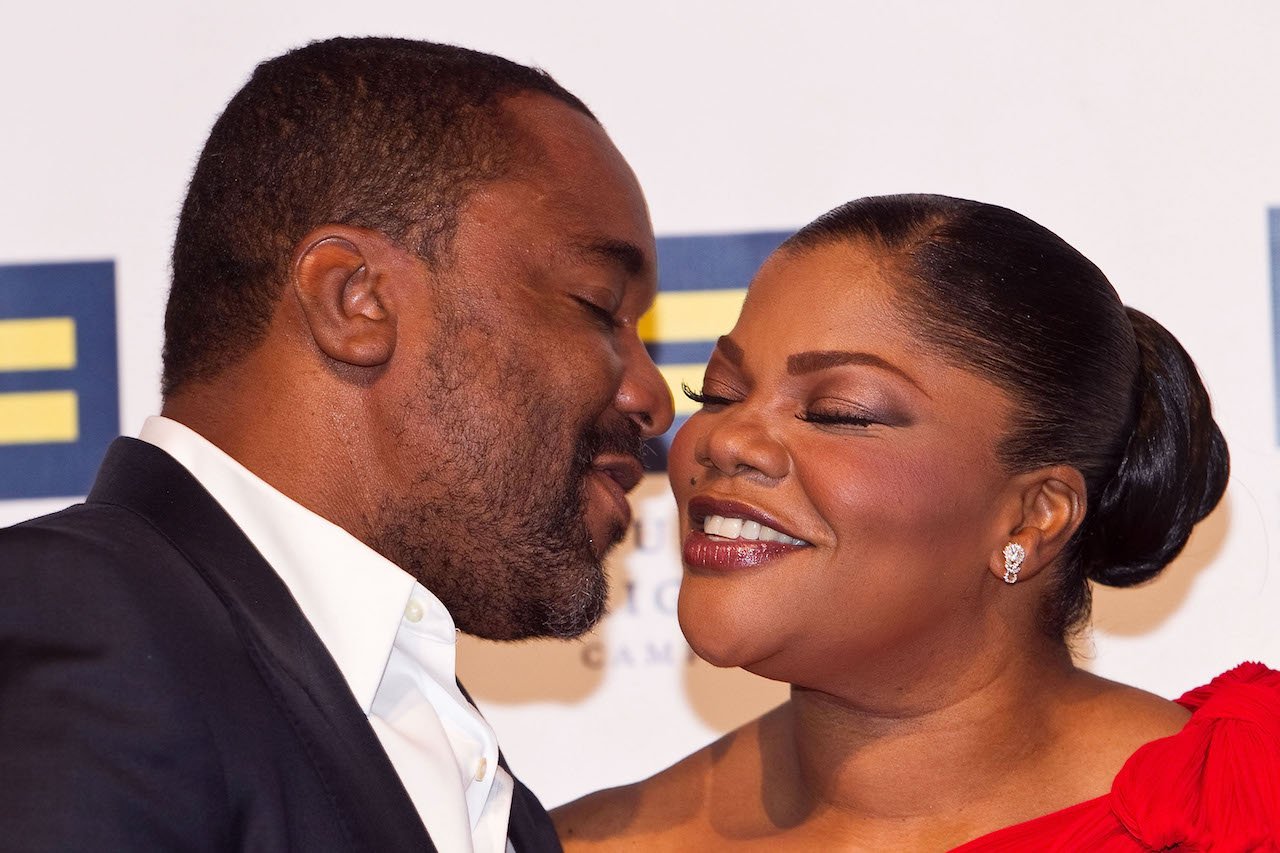 Lee Daniels and Mo'Nique embrace on red carpet