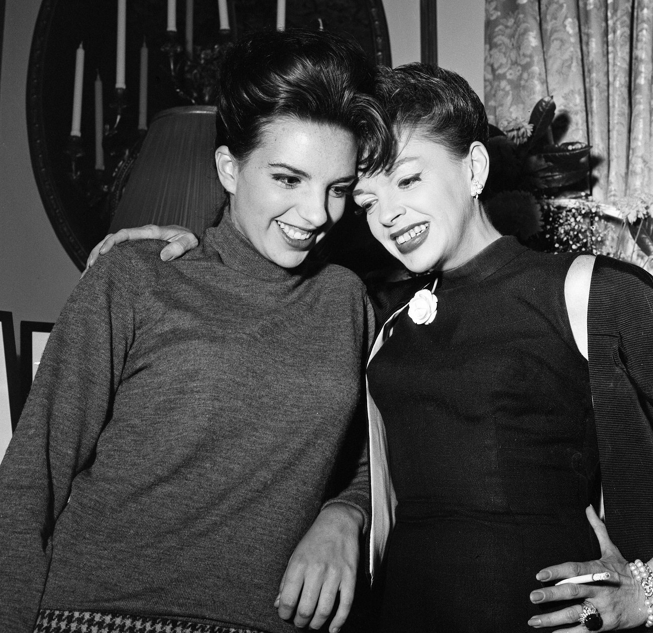 A black and white picture of Liza Minnelli and Judy Garland. Judy Garland has her arm around Liza Minnelli.
