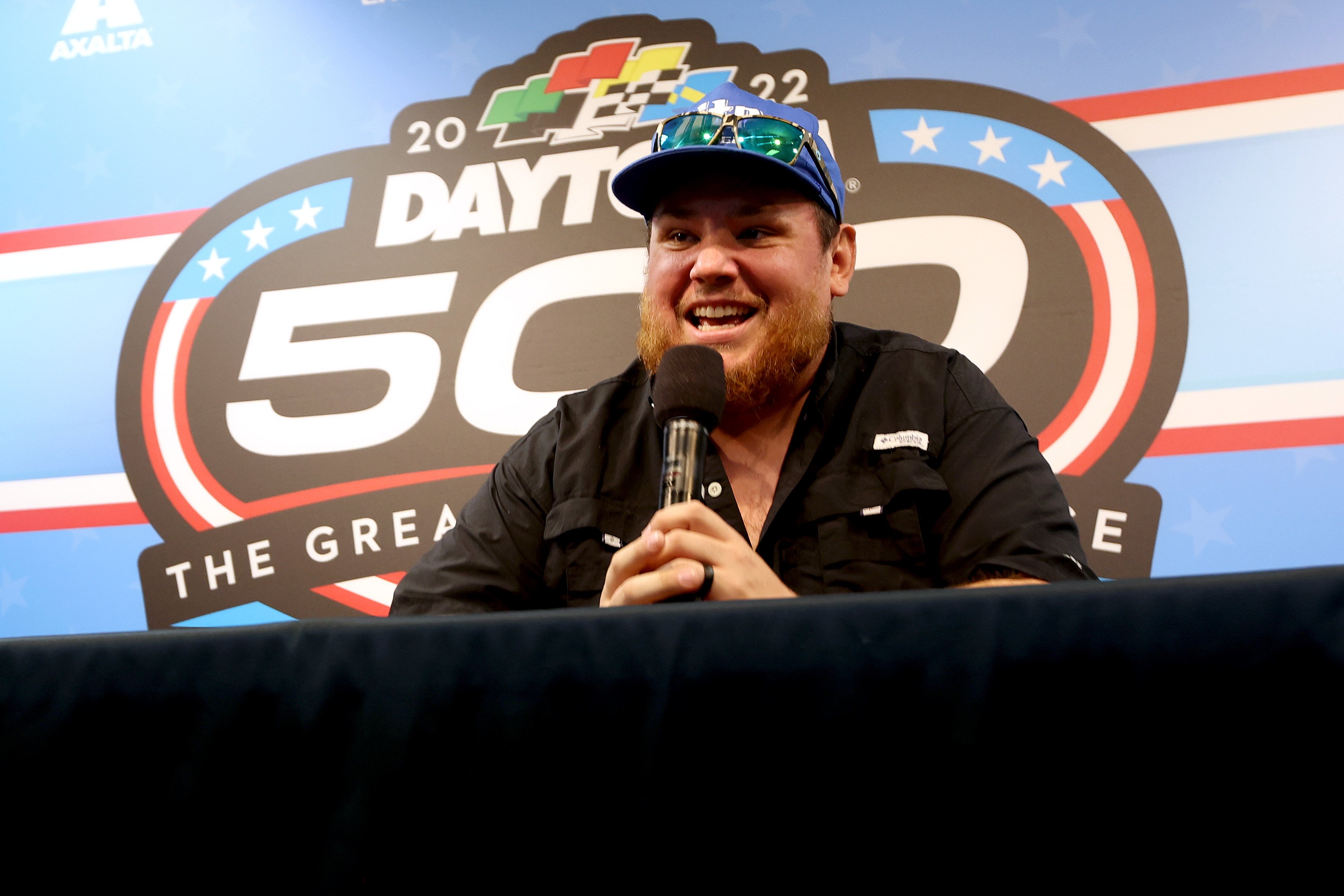 Luke Combs, who may teased fans about what his baby's name, speaks to the media during a press conference prior to the NASCAR Cup Series