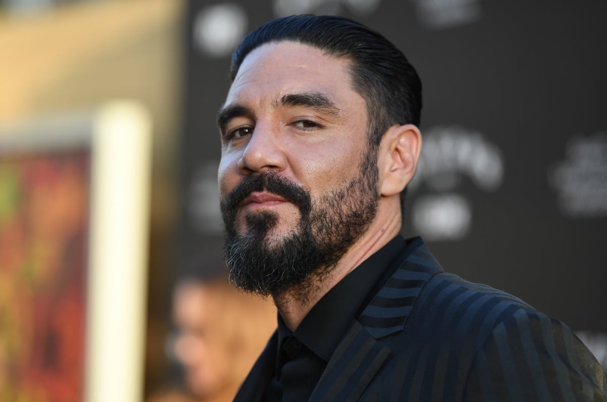 Mayans MC star Clayton Cardenas smirks as he arrives for the Season Two premiere at the ArcLight Cinerama Dome in Los Angeles on August 27, 2019