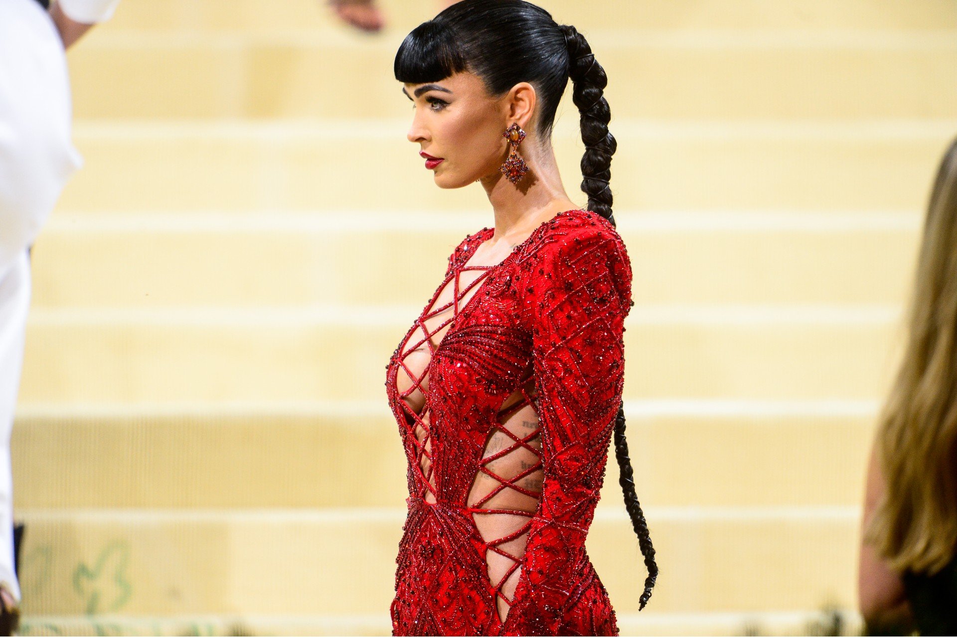 Megan Fox wears a red cut out dress at the 2021 Met Gala.