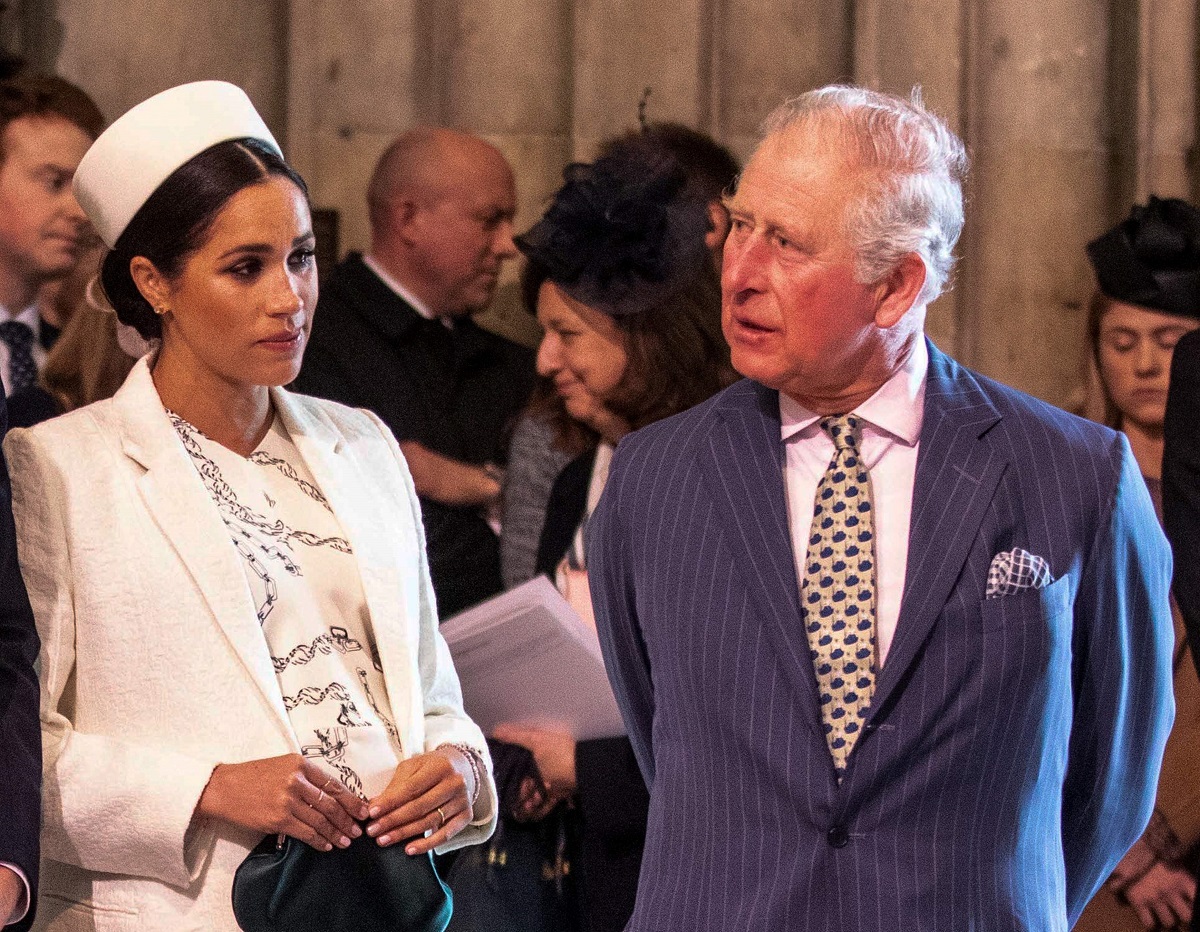Meghan Markle, whose father Thomas Markle wants to meet Prince Charles, talking with the Prince of Wales before a Commonwealth Day service in 2019