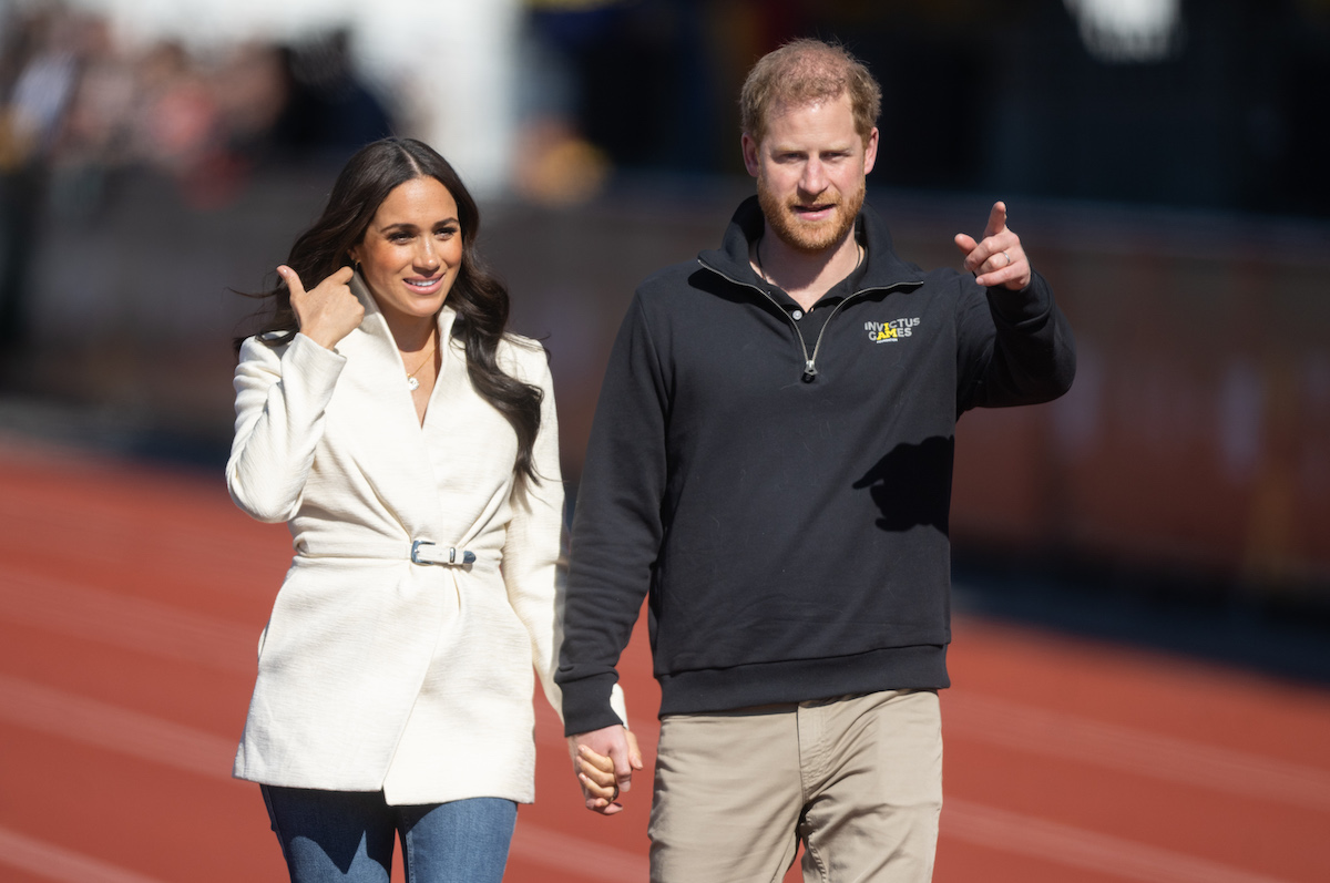 Meghan Markle and Prince Harry walk at the Invictus Games