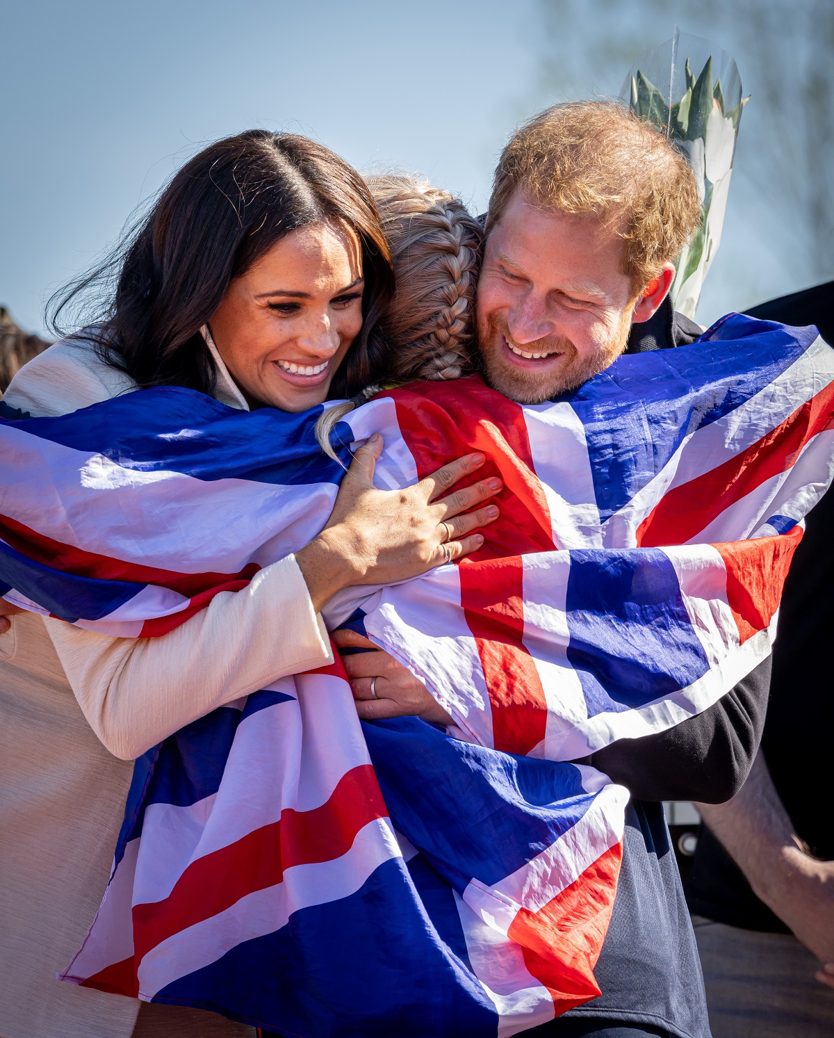 Meghan Markle and Prince Harry embrace a competitor at day two of the Invictus Games