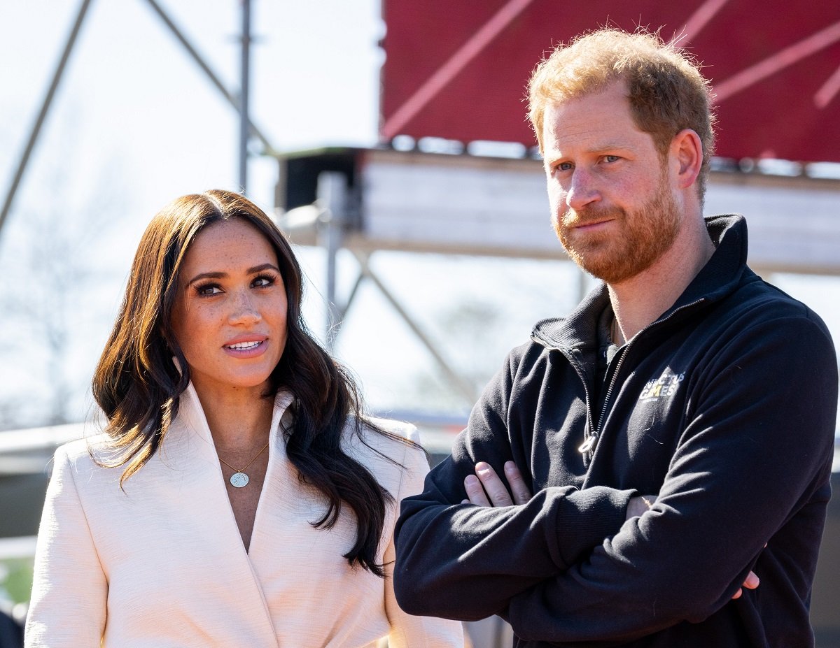 Prince Harry and Meghan Markle, whose father Thomas Markle just made an announcement on GB News, not looking pleased during day two of the Invictus Games