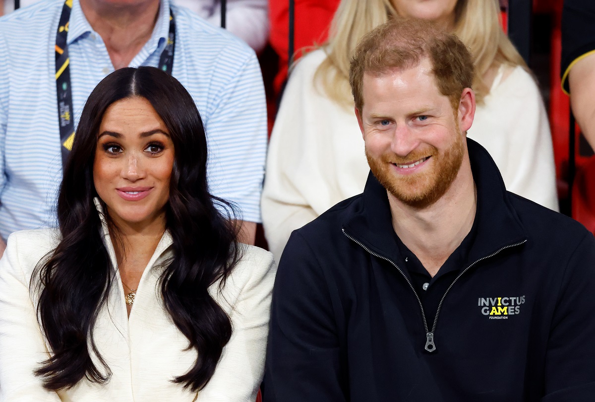 Meghan Markle, whose intention of staying in the royal family have been questioned, and Prince Harry watching a volleyball competition on day 2 of the Invictus Games