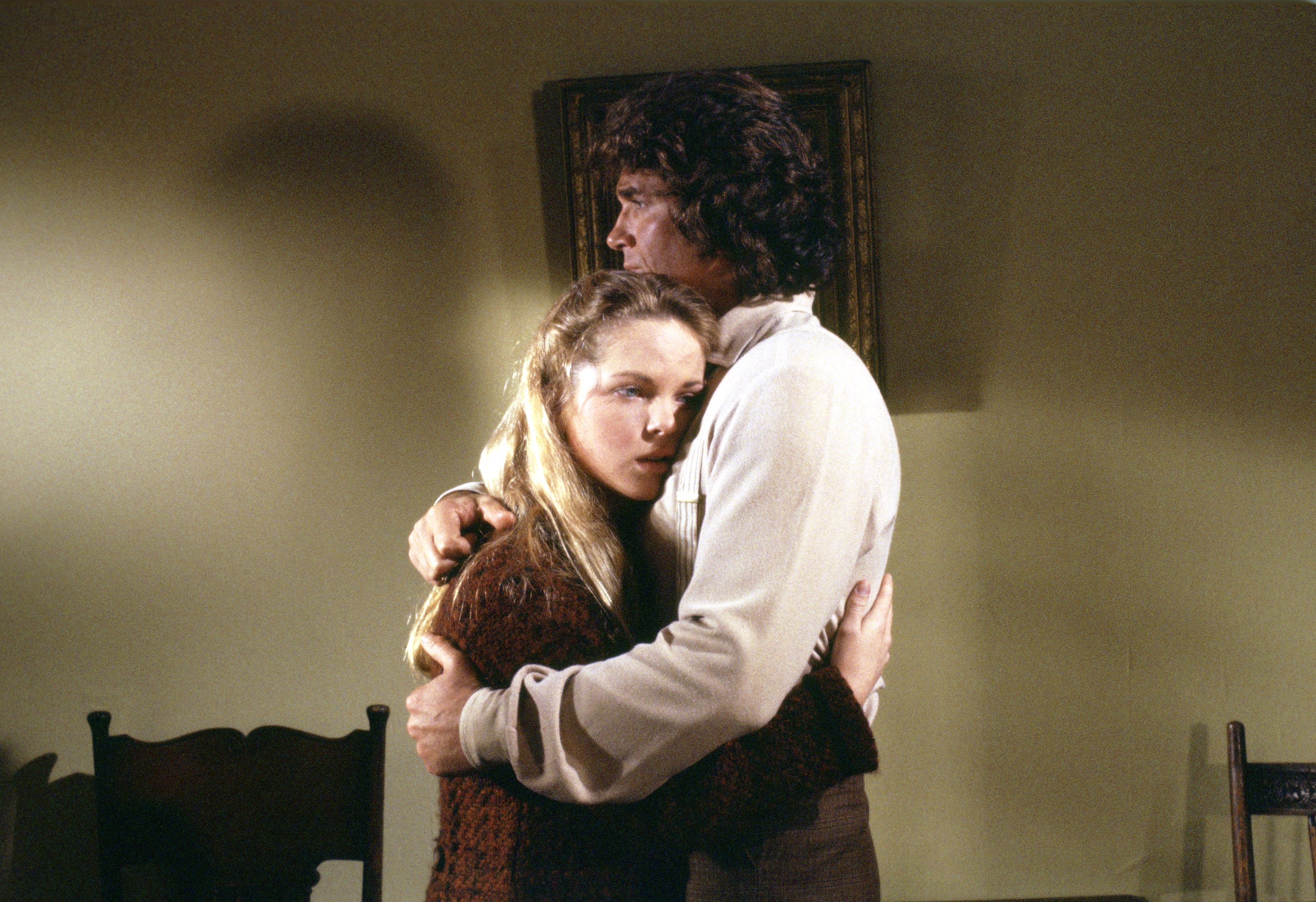 Melissa Sue Anderson hugs Michael Landon on the set of Little House on the Prairie.
