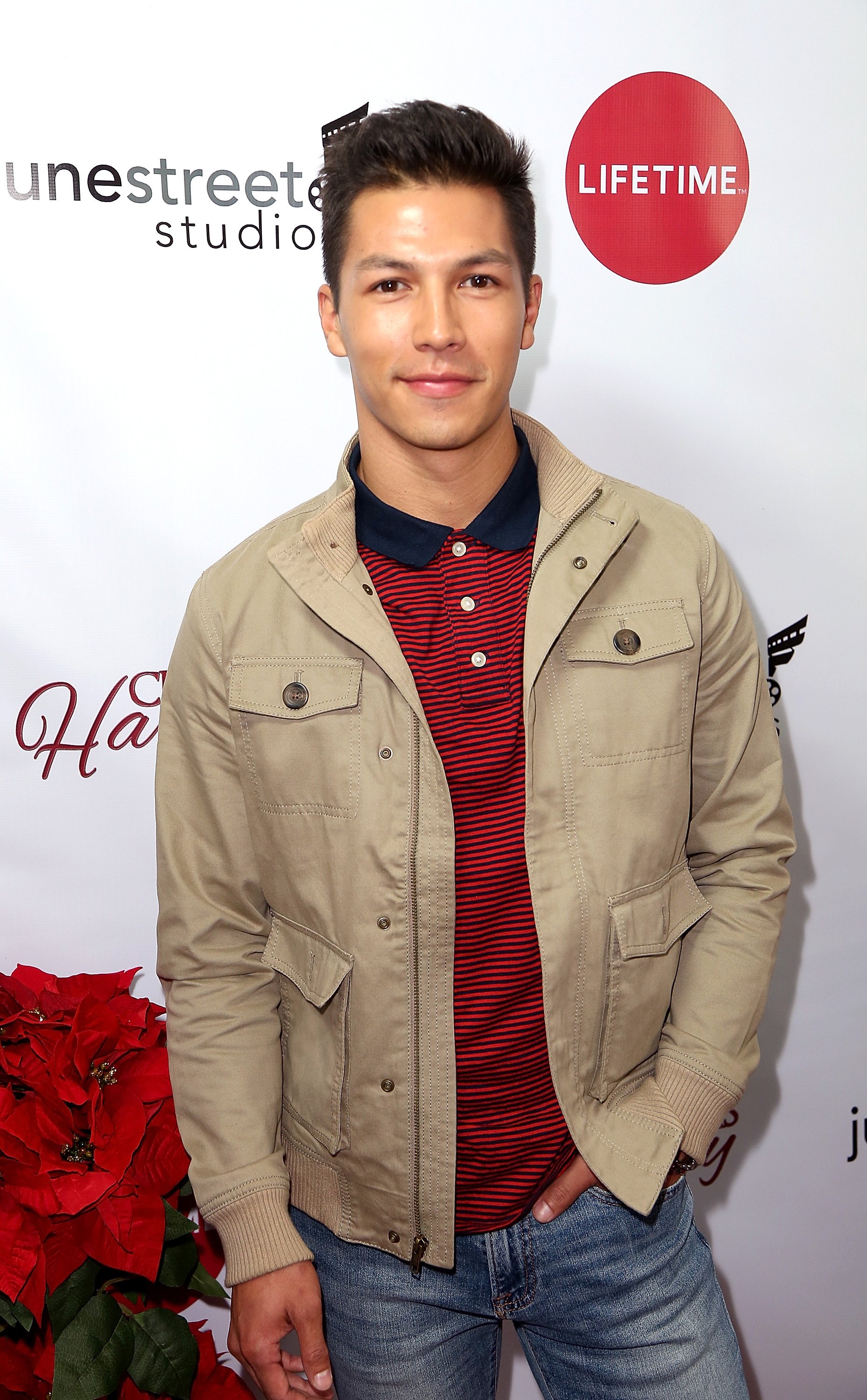 'General Hospital' actor Michael Blake Kruse wearing a red and black shirt, and a tan jacket.