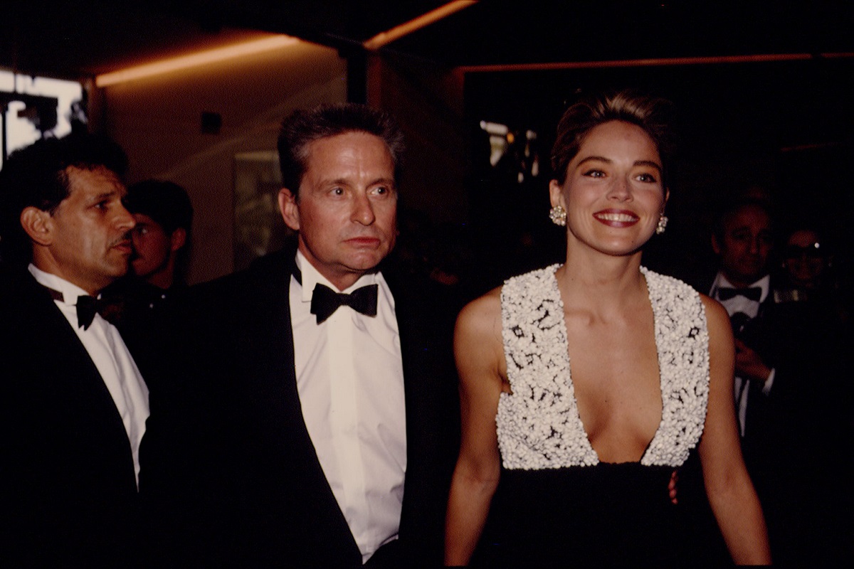 Sharon Stone smiling alongside Michael Douglas.