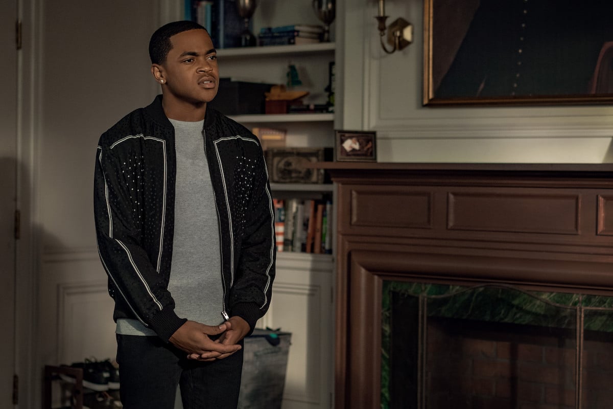 Michael Rainey Jr. as Tariq St. Patrick wearing a grey shirt and black jacket in 'Power Book II: Ghost' 