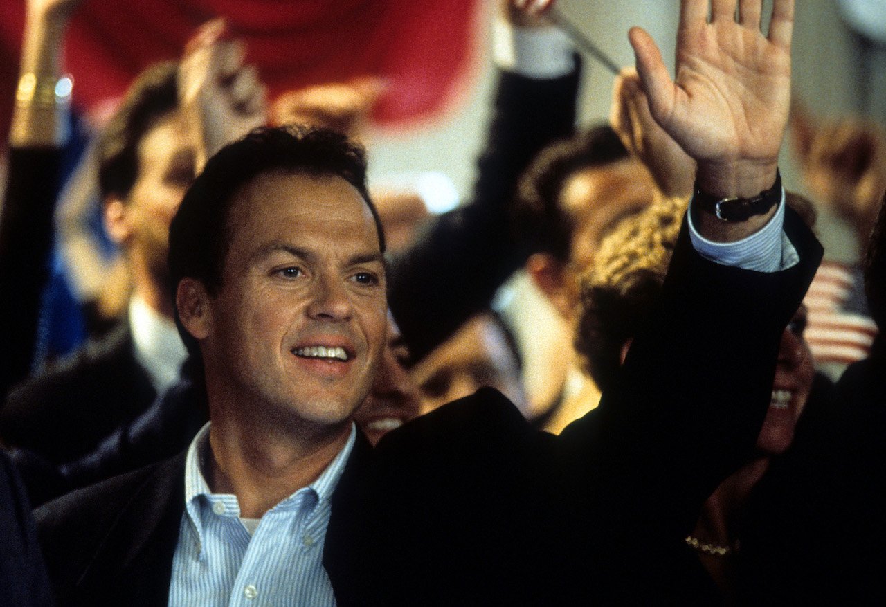 Michael Keaton waiving his hand in a scene from the 1994 film 'Speechless'