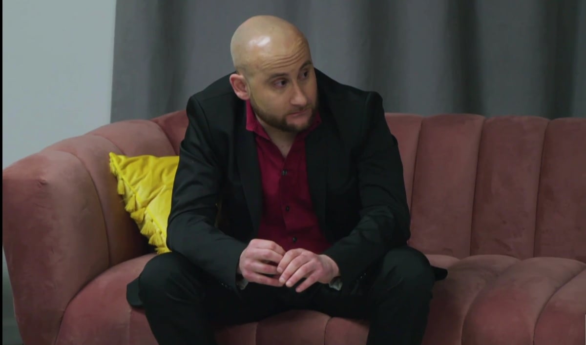 Mike Berkowitz sitting backstage on a couch during the '90 Day Fiancé: Before the 90 Days' Season 5 tell-all.