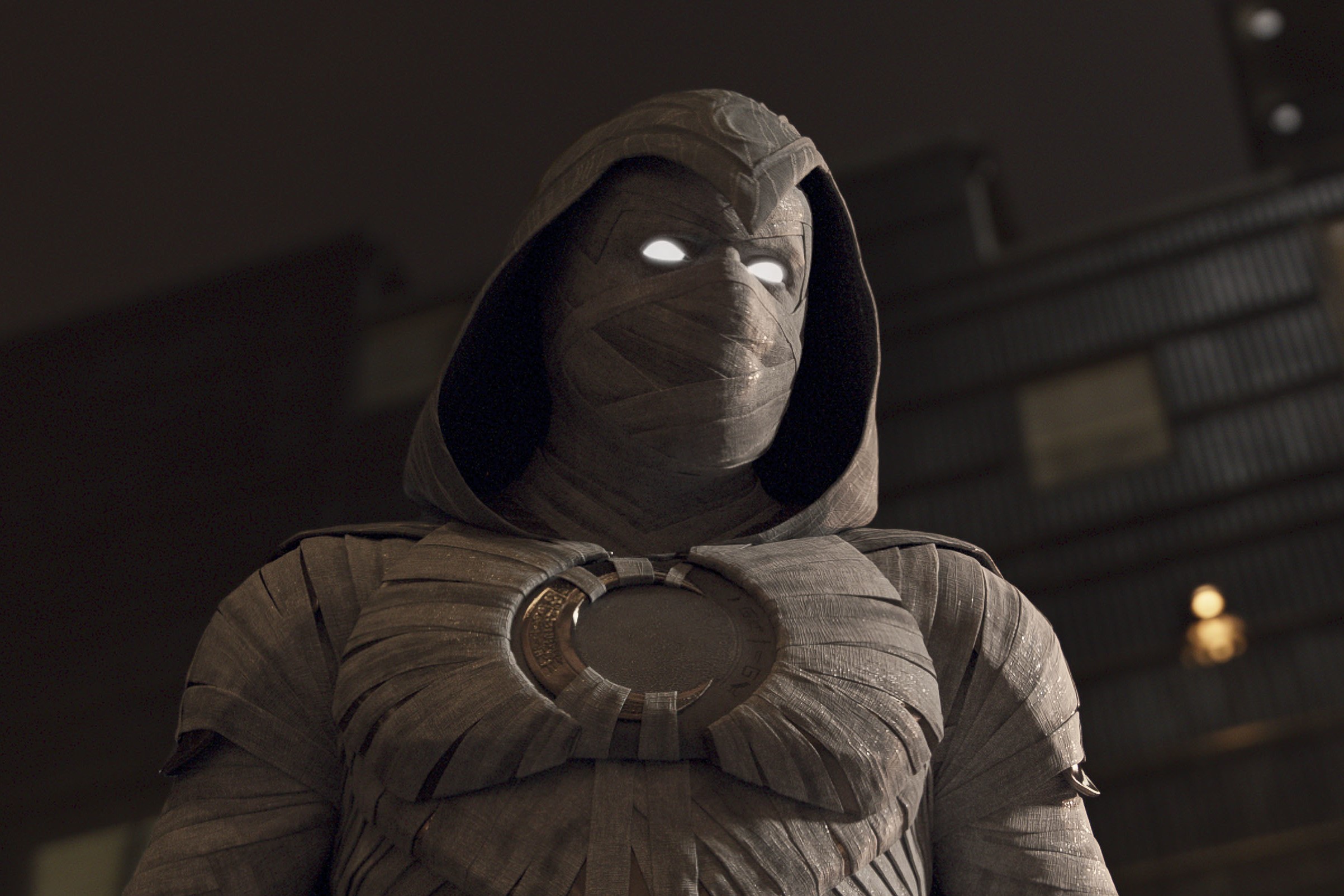 'Moon Knight' star Oscar Isaac, in character as Marc Spector, wears his white Moon Knight suit.