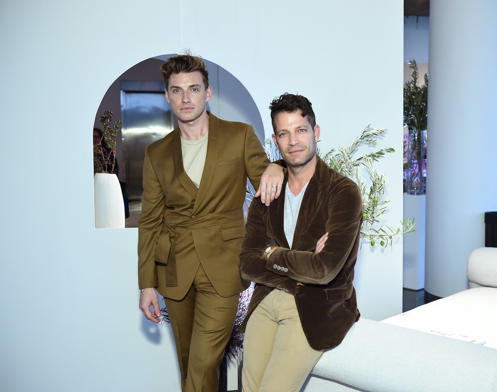 Jeremiah Brent and Nate Berkus attend Nate + Jeremiah for Living Spaces Fall 2019 Collection and pose for a photo