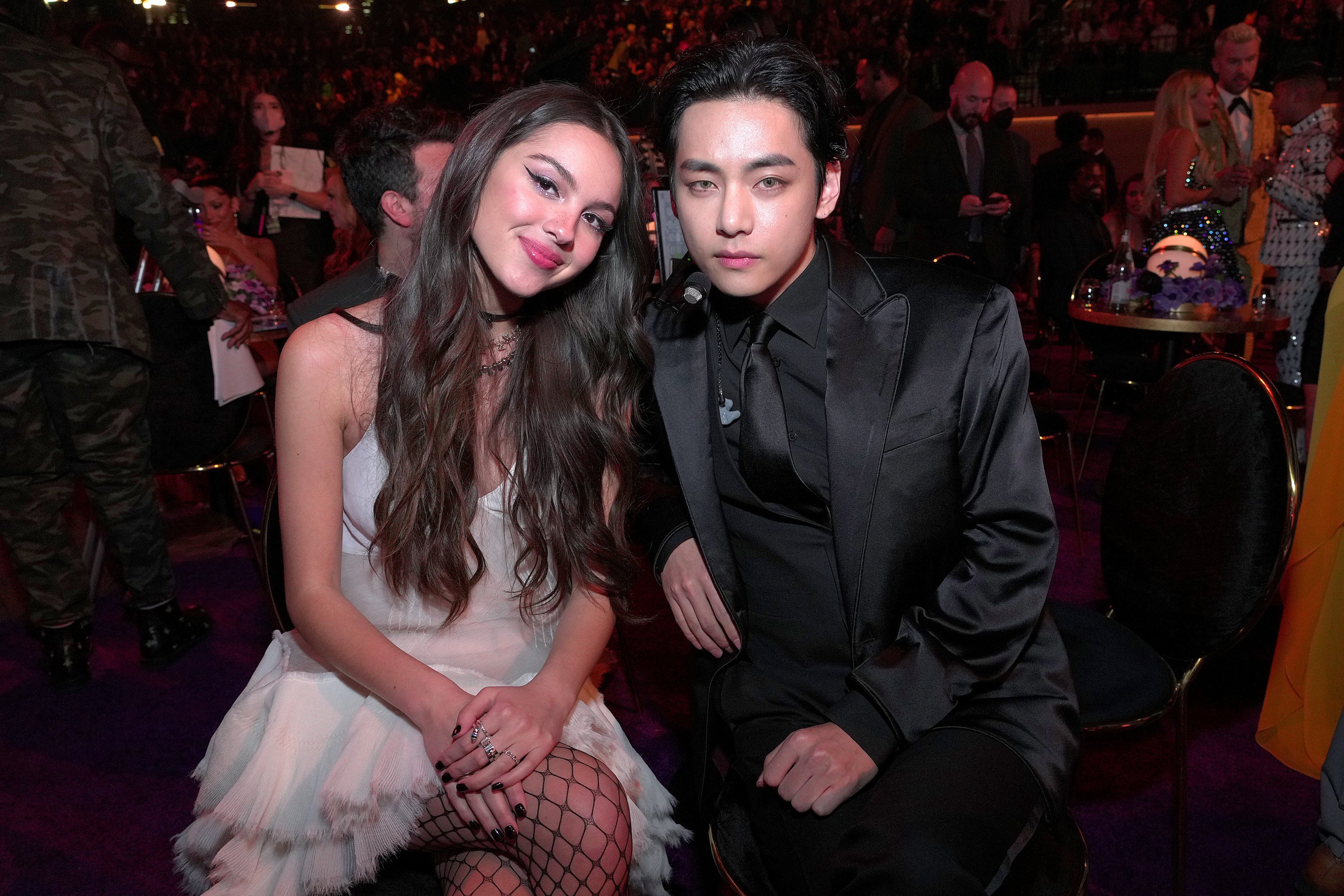 Olivia Rodrigo and V of BTS pose during the 64th Annual GRAMMY Awards at MGM Grand Garden Arena