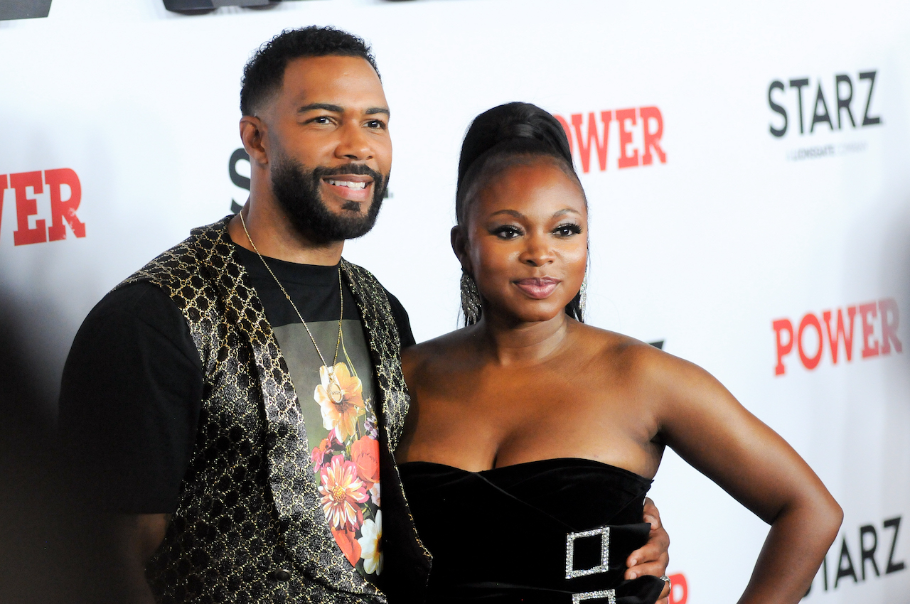 Omari Hardwick and Naturi Naughton pose for photo