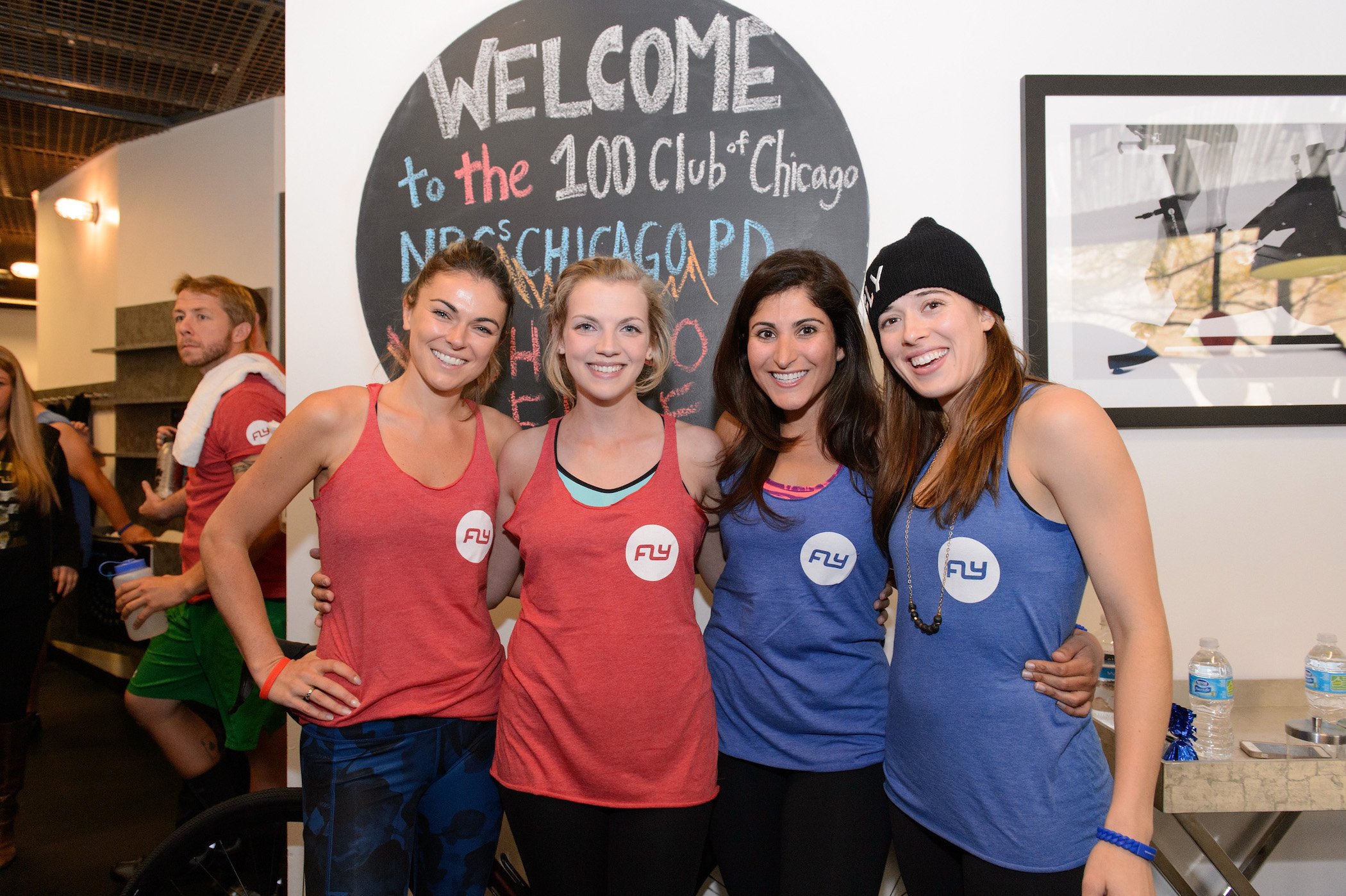 Serinda Swan, Kara Kilmer, a guest, and Marina Squerciati from 'Chicago Fire' Season 10 and 'Chicago P.D' Season 9 smiling together at an event