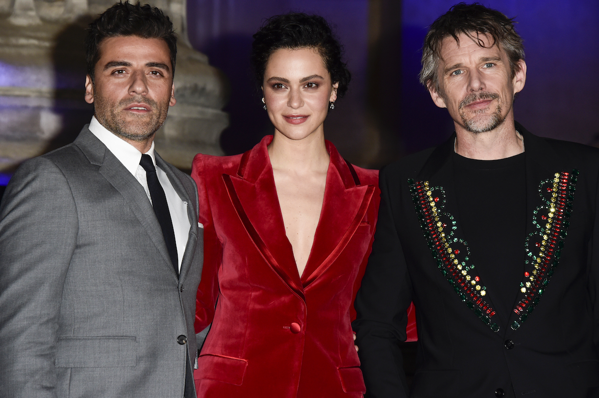 Oscar Isaac, May Calamawy, and Ethan Hawke pose for photos at the "Moon Knight" premiere in London, England