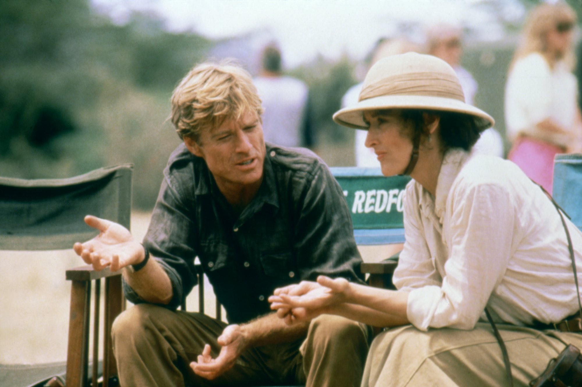 'Out of Africa' Robert Redford and Meryl Streep talking while sitting in their chairs with their names on them