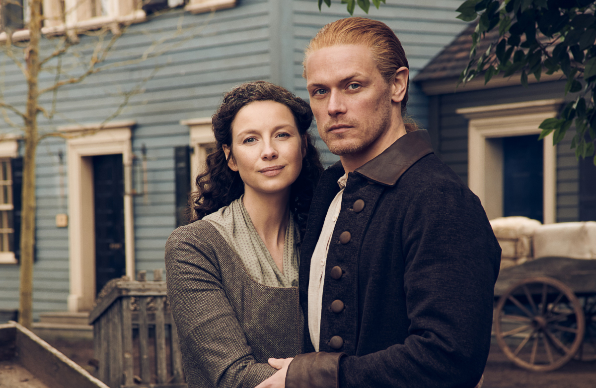 Outlander stars Caitriona Balfe and Sam Heughan in an image from season 6