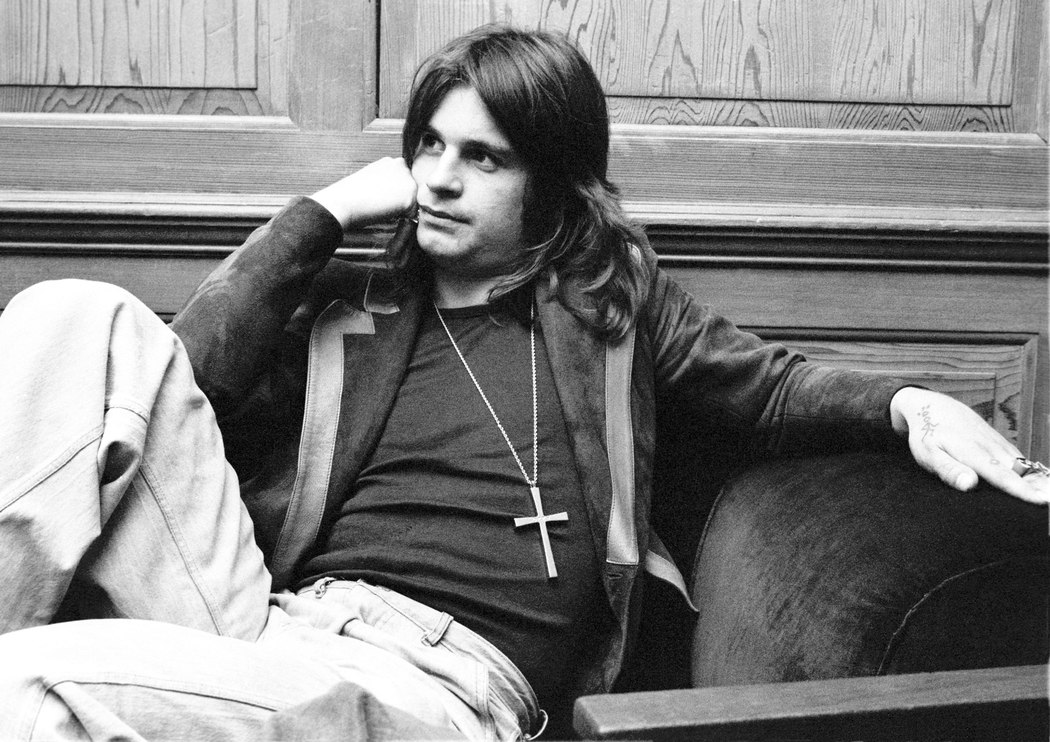 Ozzy Osbourne of Black Sabbath wearing a cross necklace