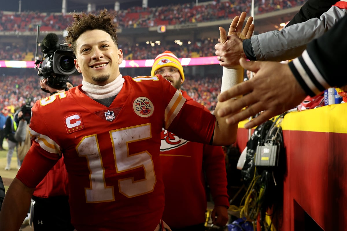 Patrick Mahomes #15 of the Kansas City Chiefs celebrates with fans after defeating the Buffalo Bills in the AFC Divisional Playoff game at Arrowhead Stadium on January 23, 2022 in Kansas City, Missouri