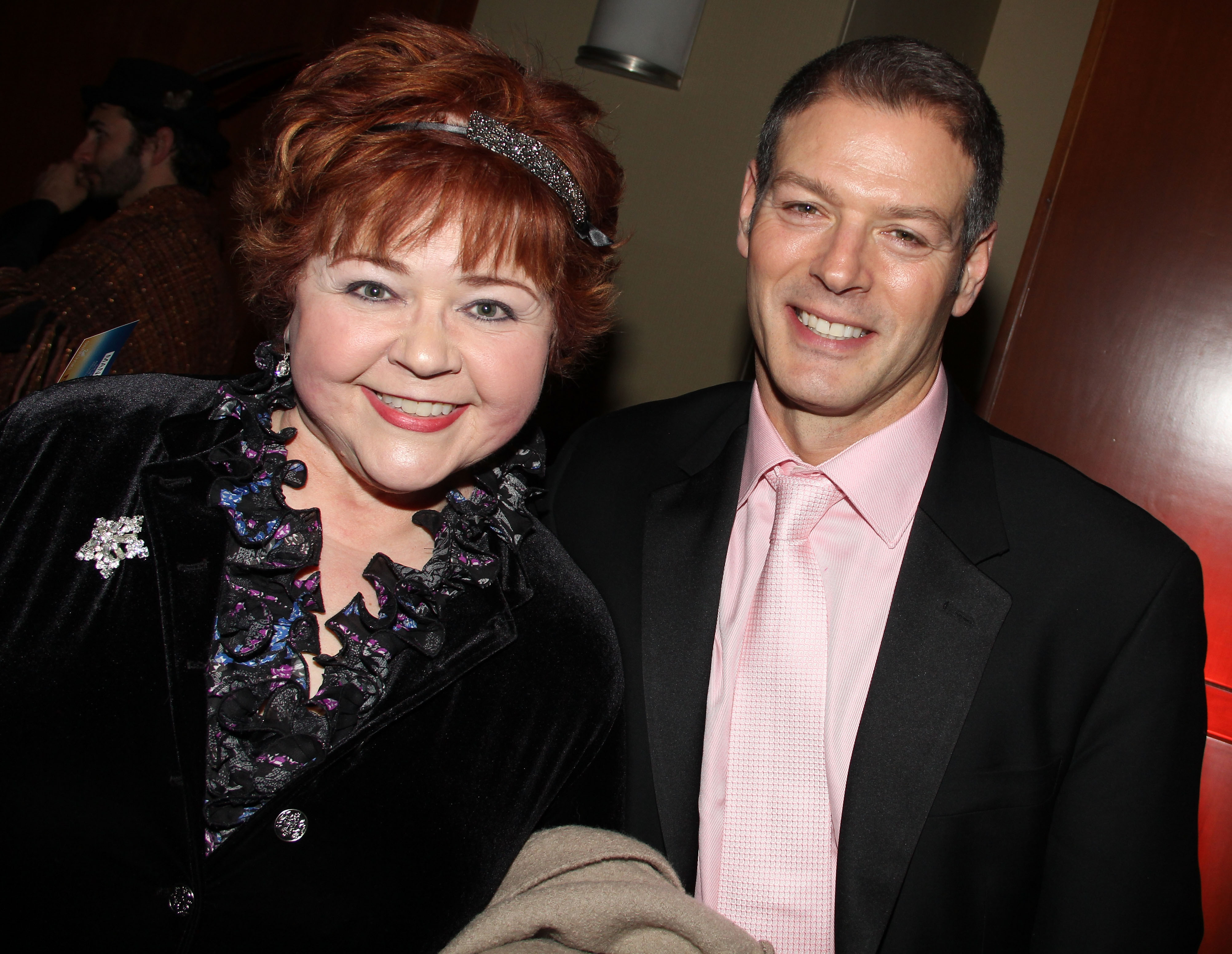 'Days of Our Lives' actor Patrika Darbo in a black dress and Kevin Spirtas in a black suit pose together for a photo.