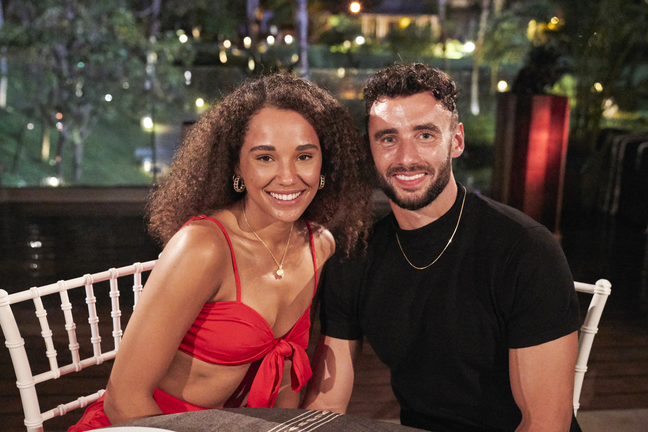 Pieper James and Brendan Morais sitting together and smiling on 'Bachelor in Paradise'